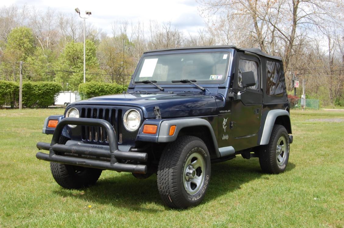 1997 Blue /Gray cloth Jeep Wrangler SE (1J4FY29P2VP) with an 2.5L L4 OHV 8V engine, 5-Speed Manual transmission, located at 6528 Lower York Road, New Hope, PA, 18938, (215) 862-9555, 40.358707, -74.977882 - Photo #0