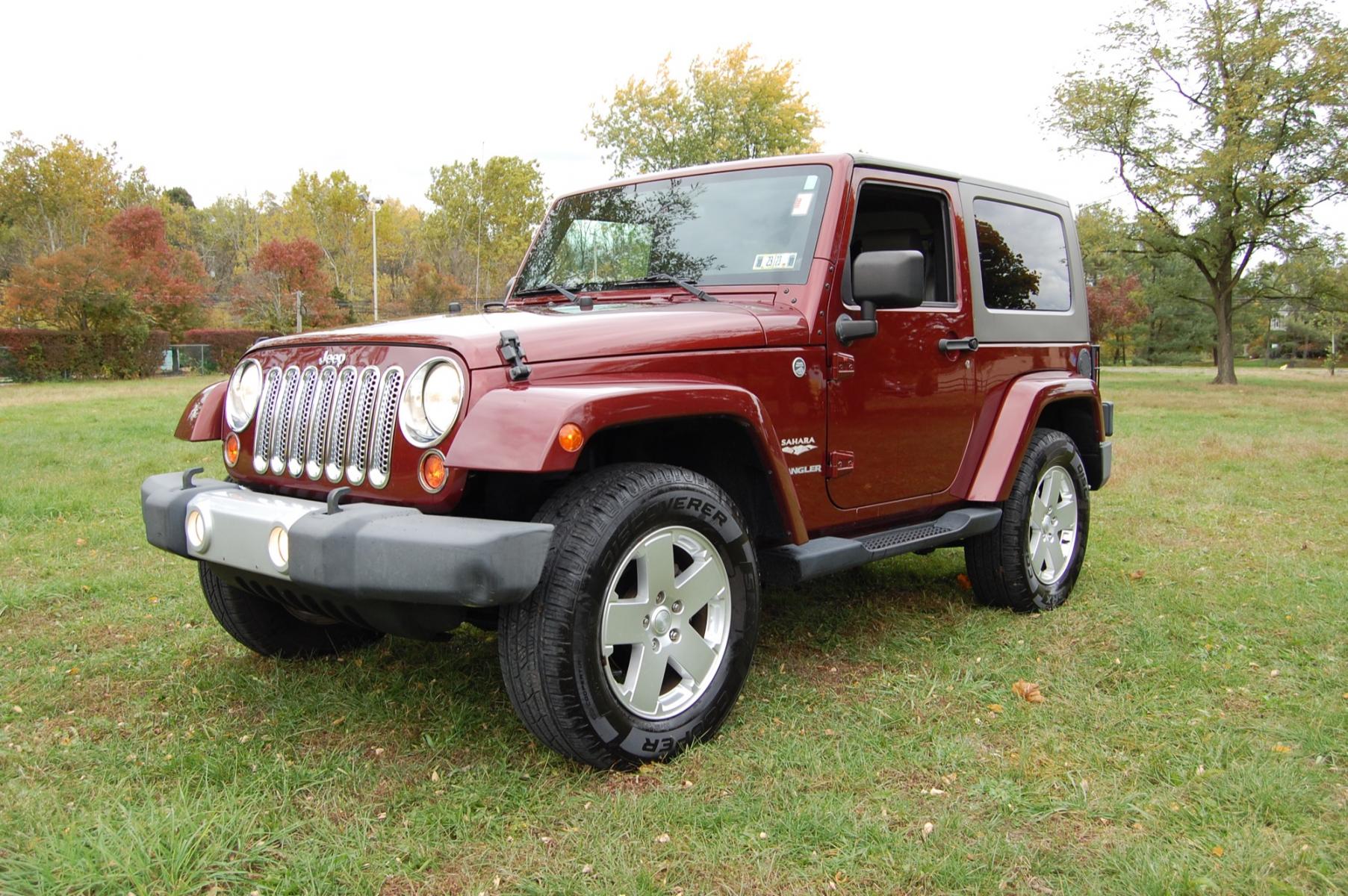 2010 Burgundy /Tan Leather Jeep Wrangler Sahara (1J4AA5D10AL) with an 3.8L V6 OHV 12V engine, Automatic transmission, located at 6528 Lower York Road, New Hope, PA, 18938, (215) 862-9555, 40.358707, -74.977882 - Photo #0