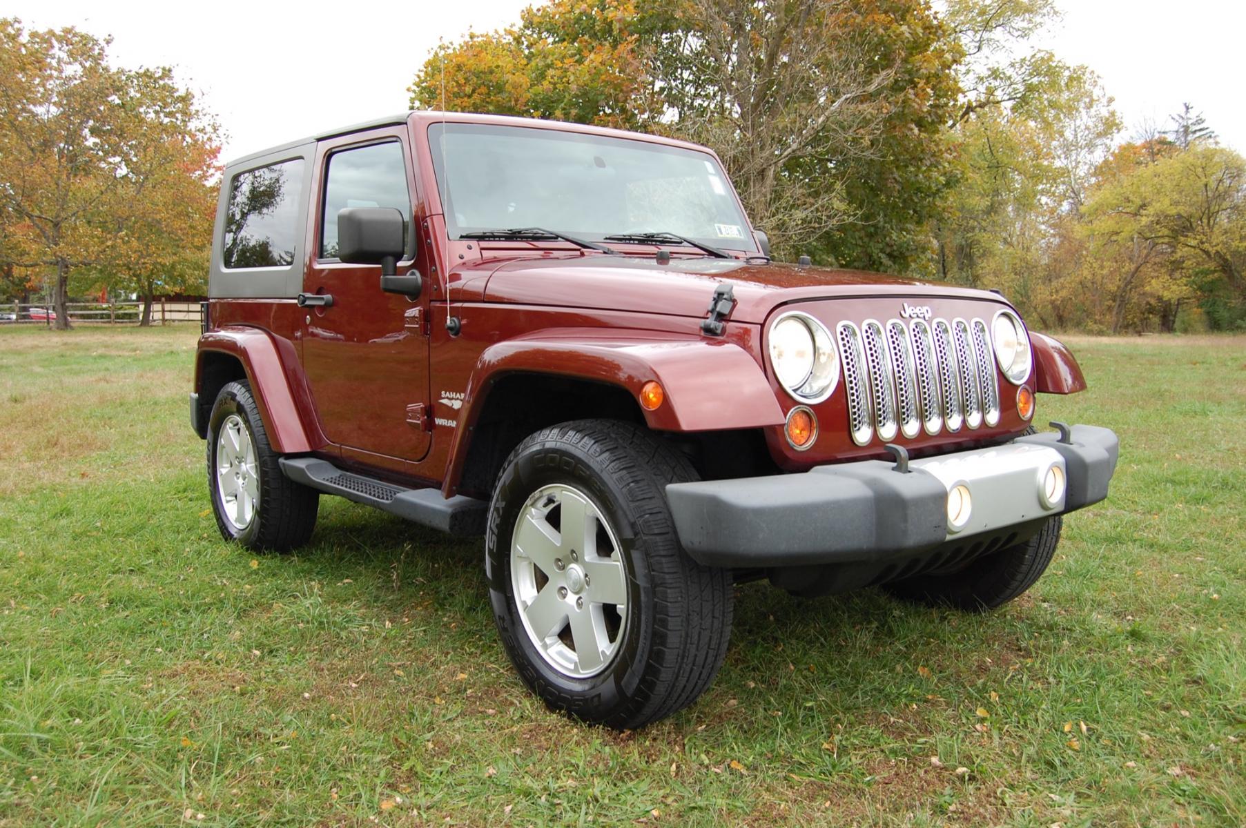 2010 Burgundy /Tan Leather Jeep Wrangler Sahara (1J4AA5D10AL) with an 3.8L V6 OHV 12V engine, Automatic transmission, located at 6528 Lower York Road, New Hope, PA, 18938, (215) 862-9555, 40.358707, -74.977882 - Photo #2