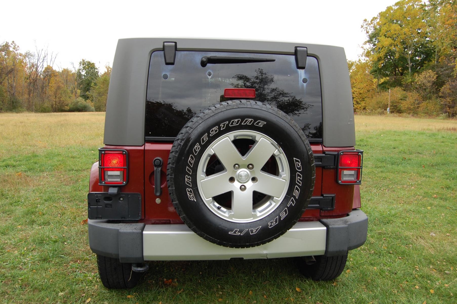 2010 Burgundy /Tan Leather Jeep Wrangler Sahara (1J4AA5D10AL) with an 3.8L V6 OHV 12V engine, Automatic transmission, located at 6528 Lower York Road, New Hope, PA, 18938, (215) 862-9555, 40.358707, -74.977882 - Photo #7