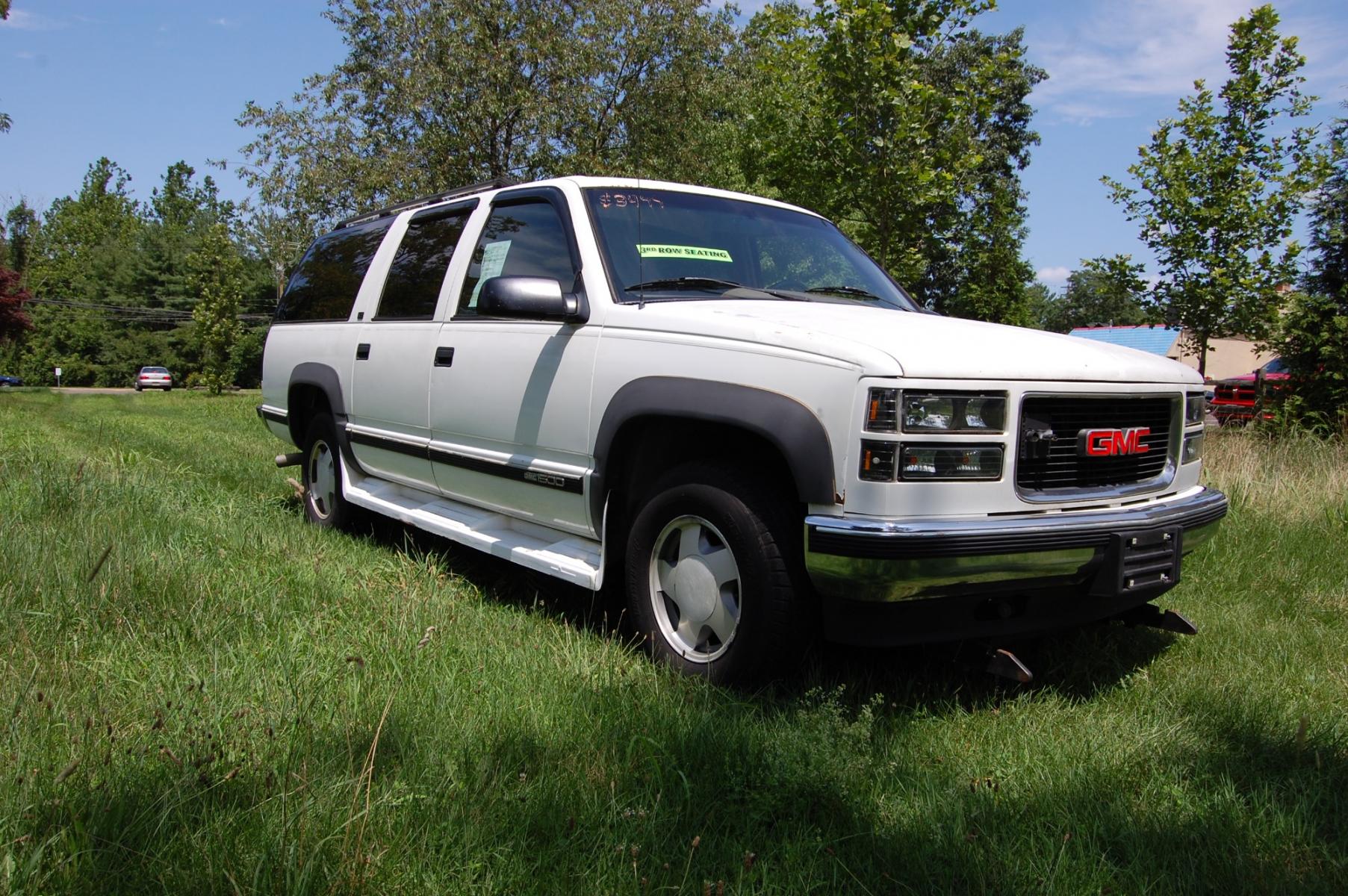 1995 White /tan GMC Suburban 1500 4WD (1GKFK16K2SJ) with an 5.7L V8 OHV 16V engine, 4-Speed Automatic Overdrive transmission, located at 6528 Lower York Road, New Hope, PA, 18938, (215) 862-9555, 40.358707, -74.977882 - This 1995 GMC 1500 Suburban SLT puts power to the ground via a 5.7L V8 with an automatic transmission with four wheel drive. The outside of this vehicle has a 9 foot Hiniker snow plow, white paint, running boards, 16 inch wheels, rain guards, rear barn doors, tow package and a roof rack. The interio - Photo #25