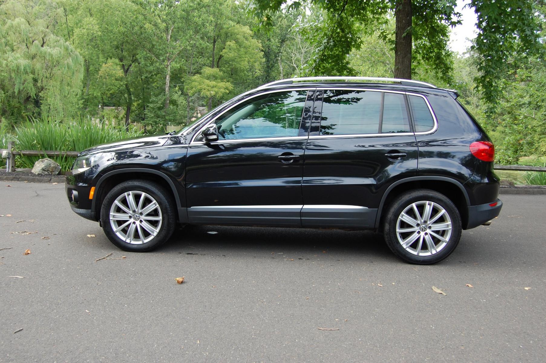 2012 Black /Black Leather Volkswagen Tiguan SE 4Motion (WVGBV7AX8CW) with an 2.0L L4 DOHC 16V TURBO engine, 6-Speed Automatic transmission, located at 6528 Lower York Road, New Hope, PA, 18938, (215) 862-9555, 40.358707, -74.977882 - Photo #0