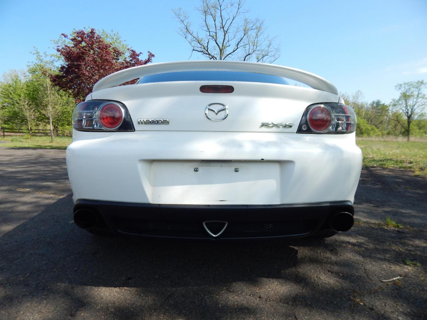 2005 White /Black Cloth Mazda RX-8 6-Speed (JM1FE173650) with an 1.3L L2 ROTARY engine, Manual transmission, located at 6528 Lower York Road, New Hope, PA, 18938, (215) 862-9555, 40.358707, -74.977882 - Here we have a Mazda RX-8 with a 1.3L Rotary engine putting power to the rear wheels via a smooth shifting 6 speed manual transmission. Options include: black cloth, AM/FM/CD/TAPE radio, tilt steering wheel, cruise control, power windows/locks/mirrors, sunroof, dual aftermarket exhaust, aftermarket - Photo#3