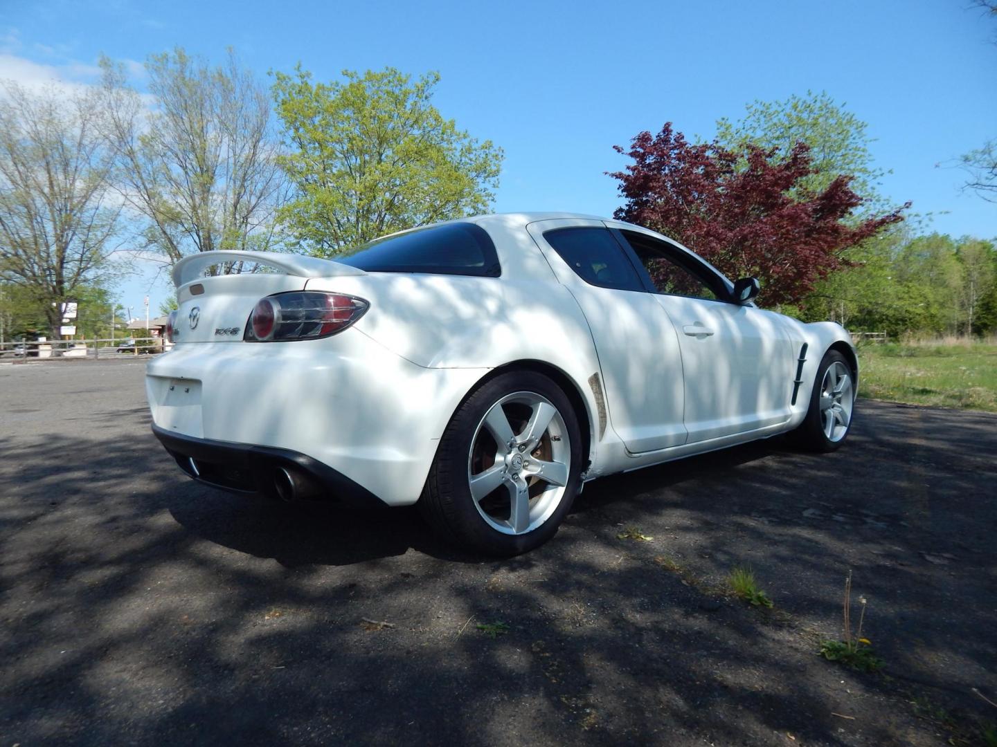 2005 White /Black Cloth Mazda RX-8 6-Speed (JM1FE173650) with an 1.3L L2 ROTARY engine, Manual transmission, located at 6528 Lower York Road, New Hope, PA, 18938, (215) 862-9555, 40.358707, -74.977882 - Here we have a Mazda RX-8 with a 1.3L Rotary engine putting power to the rear wheels via a smooth shifting 6 speed manual transmission. Options include: black cloth, AM/FM/CD/TAPE radio, tilt steering wheel, cruise control, power windows/locks/mirrors, sunroof, dual aftermarket exhaust, aftermarket - Photo#5