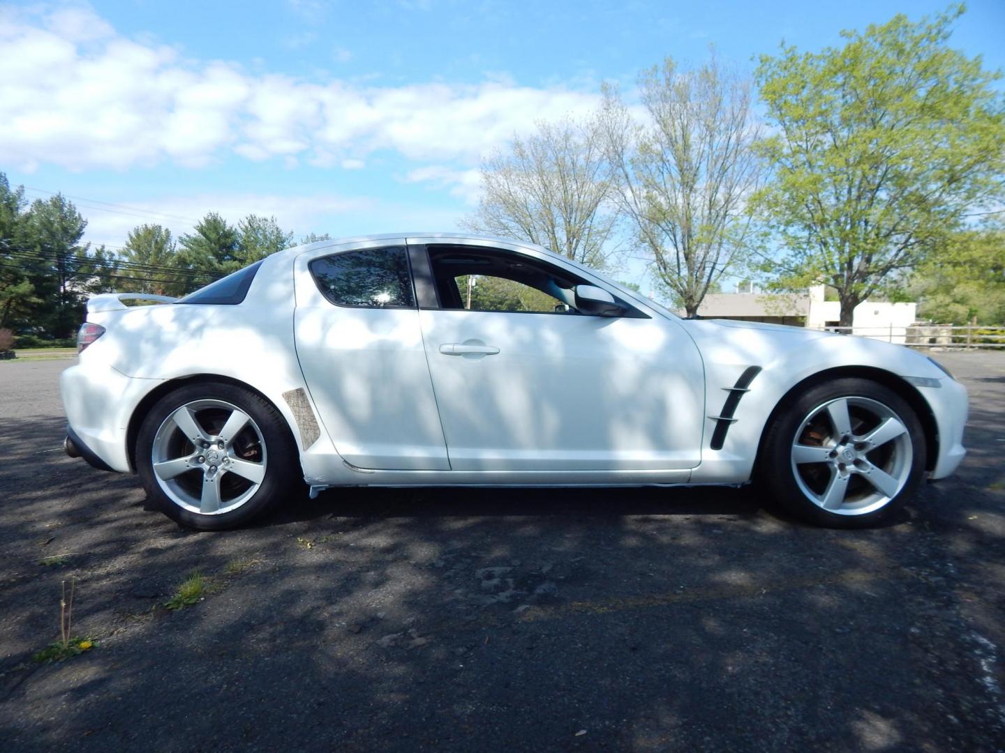 2005 White /Black Cloth Mazda RX-8 6-Speed (JM1FE173650) with an 1.3L L2 ROTARY engine, Manual transmission, located at 6528 Lower York Road, New Hope, PA, 18938, (215) 862-9555, 40.358707, -74.977882 - Here we have a Mazda RX-8 with a 1.3L Rotary engine putting power to the rear wheels via a smooth shifting 6 speed manual transmission. Options include: black cloth, AM/FM/CD/TAPE radio, tilt steering wheel, cruise control, power windows/locks/mirrors, sunroof, dual aftermarket exhaust, aftermarket - Photo#6