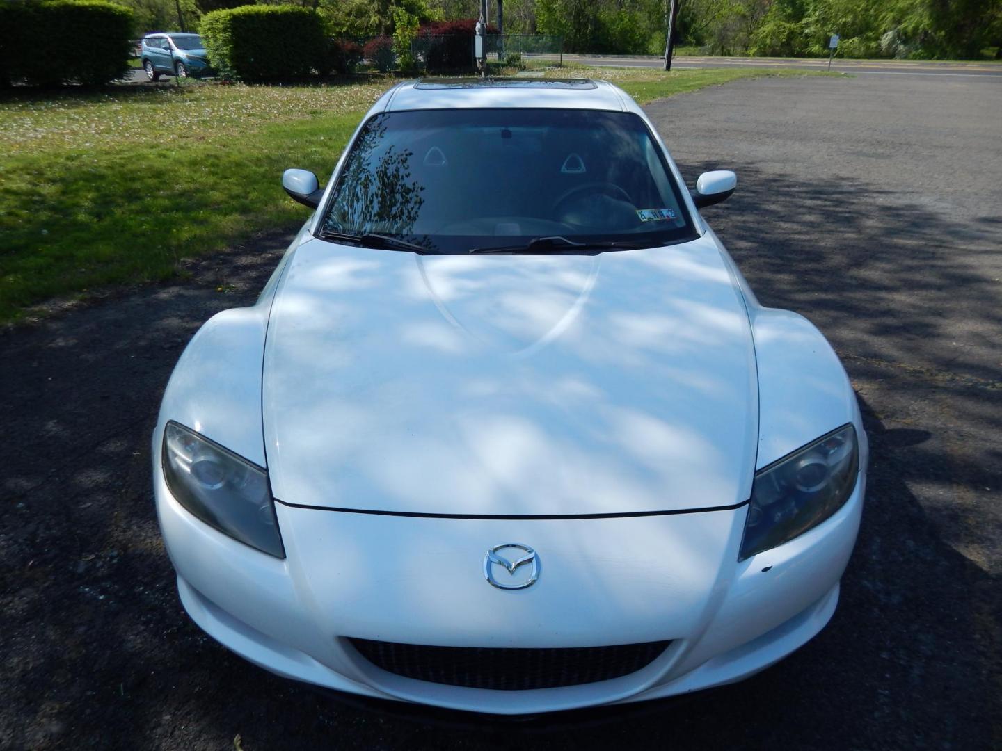 2005 White /Black Cloth Mazda RX-8 6-Speed (JM1FE173650) with an 1.3L L2 ROTARY engine, Manual transmission, located at 6528 Lower York Road, New Hope, PA, 18938, (215) 862-9555, 40.358707, -74.977882 - Here we have a Mazda RX-8 with a 1.3L Rotary engine putting power to the rear wheels via a smooth shifting 6 speed manual transmission. Options include: black cloth, AM/FM/CD/TAPE radio, tilt steering wheel, cruise control, power windows/locks/mirrors, sunroof, dual aftermarket exhaust, aftermarket - Photo#9