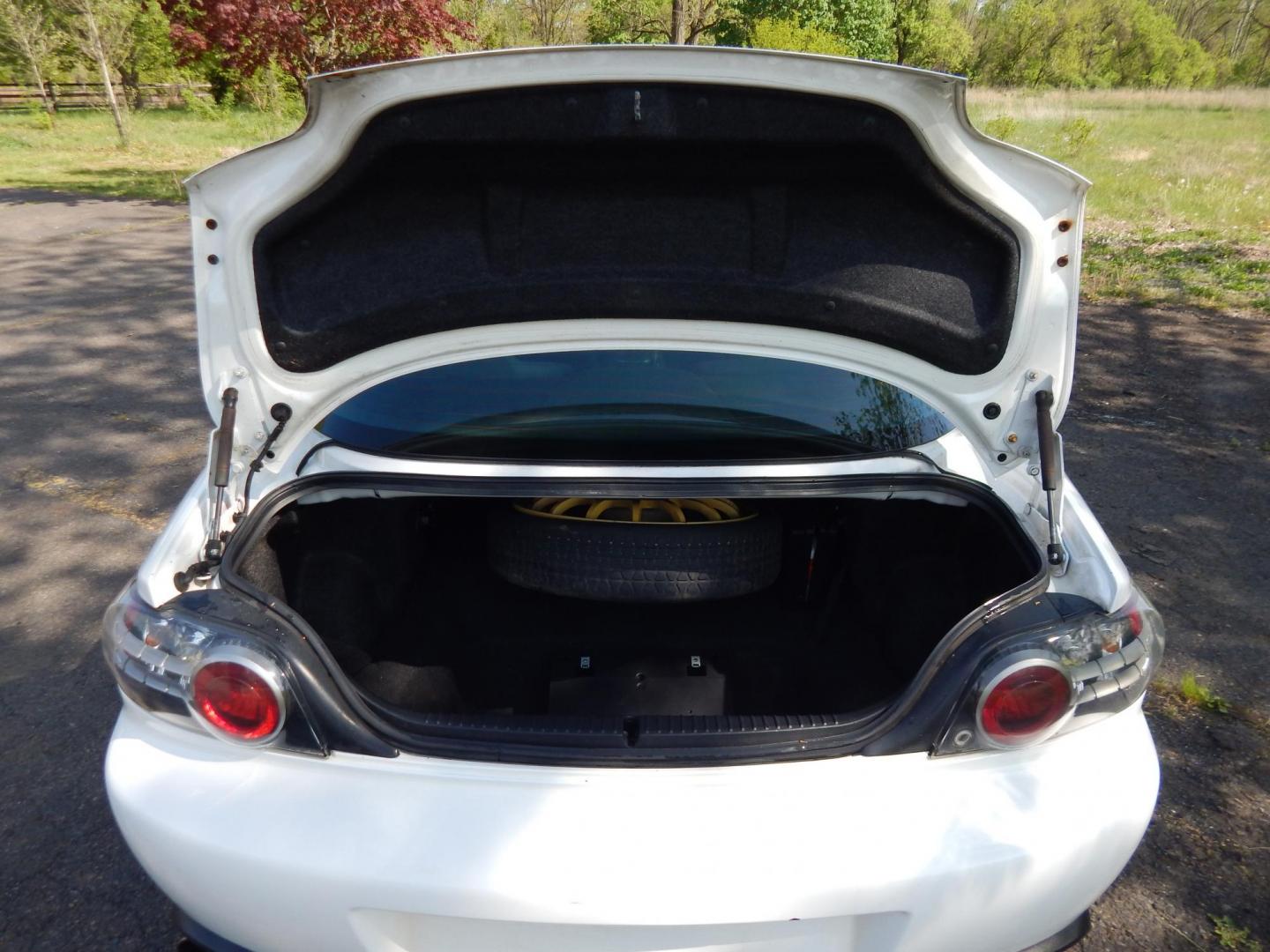 2005 White /Black Cloth Mazda RX-8 6-Speed (JM1FE173650) with an 1.3L L2 ROTARY engine, Manual transmission, located at 6528 Lower York Road, New Hope, PA, 18938, (215) 862-9555, 40.358707, -74.977882 - Here we have a Mazda RX-8 with a 1.3L Rotary engine putting power to the rear wheels via a smooth shifting 6 speed manual transmission. Options include: black cloth, AM/FM/CD/TAPE radio, tilt steering wheel, cruise control, power windows/locks/mirrors, sunroof, dual aftermarket exhaust, aftermarket - Photo#16