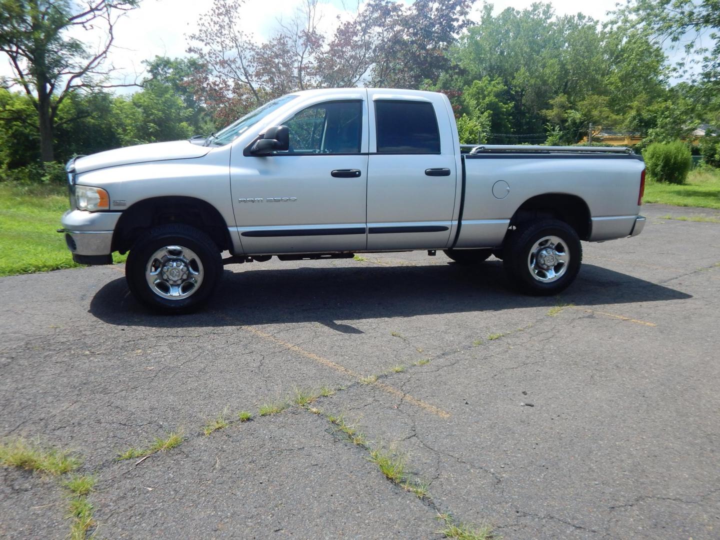 2004 Silver /Gray Dodge Ram 2500 Laramie Quad Cab 4WD (3D7KU28D94G) with an 5.7L V8 OHV 16V engine, Automatic transmission, located at 6528 Lower York Road, New Hope, PA, 18938, (215) 862-9555, 40.358707, -74.977882 - Here we have a 2004 Dodge Ram 2500 with a 5.7L V8 putting power to an automatic 4x4 transmission. Options include: gray cloth, keyless entry, 2 keys and 2 remotes, cruise control, tilt steering wheel, AC, power windows, power locks, power mirrors, AM/FM/CD radio, 6 seats, 17 inch wheels, tow hitch, - Photo#1