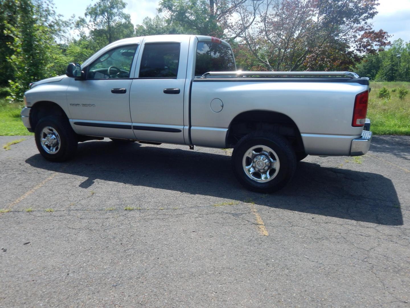 2004 Silver /Gray Dodge Ram 2500 Laramie Quad Cab 4WD (3D7KU28D94G) with an 5.7L V8 OHV 16V engine, Automatic transmission, located at 6528 Lower York Road, New Hope, PA, 18938, (215) 862-9555, 40.358707, -74.977882 - Here we have a 2004 Dodge Ram 2500 with a 5.7L V8 putting power to an automatic 4x4 transmission. Options include: gray cloth, keyless entry, 2 keys and 2 remotes, cruise control, tilt steering wheel, AC, power windows, power locks, power mirrors, AM/FM/CD radio, 6 seats, 17 inch wheels, tow hitch, - Photo#2