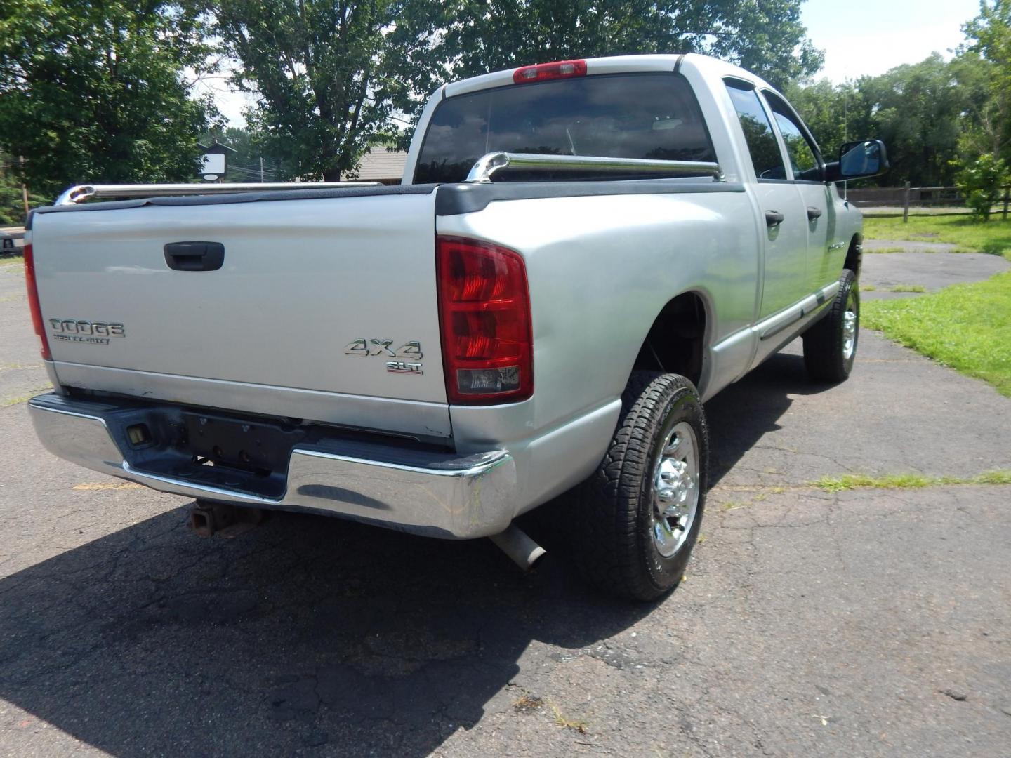 2004 Silver /Gray Dodge Ram 2500 Laramie Quad Cab 4WD (3D7KU28D94G) with an 5.7L V8 OHV 16V engine, Automatic transmission, located at 6528 Lower York Road, New Hope, PA, 18938, (215) 862-9555, 40.358707, -74.977882 - Here we have a 2004 Dodge Ram 2500 with a 5.7L V8 putting power to an automatic 4x4 transmission. Options include: gray cloth, keyless entry, 2 keys and 2 remotes, cruise control, tilt steering wheel, AC, power windows, power locks, power mirrors, AM/FM/CD radio, 6 seats, 17 inch wheels, tow hitch, - Photo#4