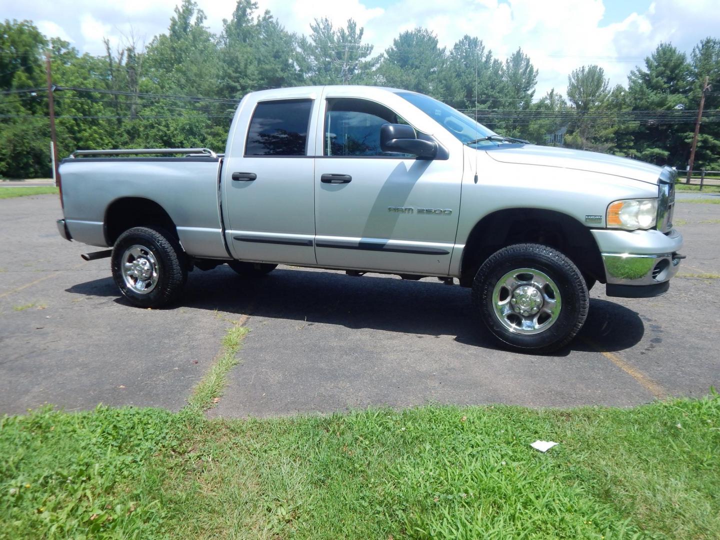 2004 Silver /Gray Dodge Ram 2500 Laramie Quad Cab 4WD (3D7KU28D94G) with an 5.7L V8 OHV 16V engine, Automatic transmission, located at 6528 Lower York Road, New Hope, PA, 18938, (215) 862-9555, 40.358707, -74.977882 - Here we have a 2004 Dodge Ram 2500 with a 5.7L V8 putting power to an automatic 4x4 transmission. Options include: gray cloth, keyless entry, 2 keys and 2 remotes, cruise control, tilt steering wheel, AC, power windows, power locks, power mirrors, AM/FM/CD radio, 6 seats, 17 inch wheels, tow hitch, - Photo#6