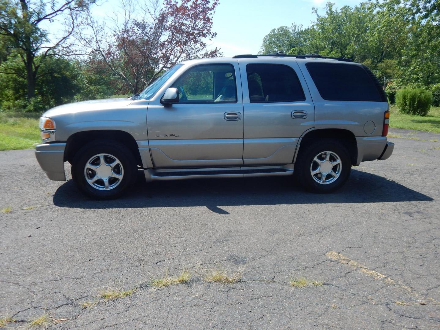 2002 Tan /Gray GMC Yukon Denali Base (1GKEK63U22J) with an 6.0L V8 OHV 16V engine, 4-Speed Automatic Overdrive transmission, located at 6528 Lower York Road, New Hope, PA, 18938, (215) 862-9555, 40.358707, -74.977882 - Here we have a 2002 GMC Yukon Denali with a 6.0L V8 putting power to an AWD automatic transmission. Options include: gray leather, power seats, heated seats front and middle row, 3 row seating, heat, A/C, rear climate controls, AM/FM/CD/TAPE radio, tilt steering wheel, rear windshield wiper, power w - Photo#1