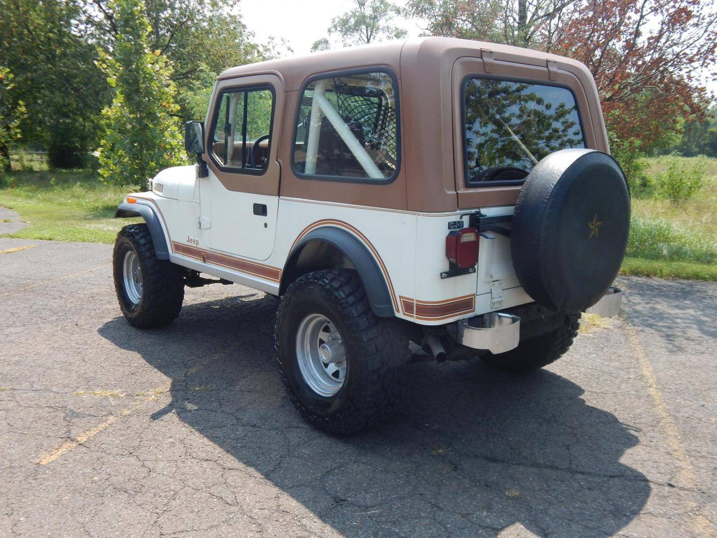 1983 White /Tan Jeep CJ7 Base (1JCCN87E0DT) with an 4.2L L6 OHV engine, Manual transmission, located at 6528 Lower York Road, New Hope, PA, 18938, (215) 862-9555, 40.358707, -74.977882 - Here we have a 1983 CJ-7 Laredo with a 4.2L straight six putting power to an 4x4 manual transmission. This CJ has saddle colored leather seats, sliding windows, hard top, lockers on both axles, new muffler, new bearings and 15 inch alloy wheels with 4 Mickey Thompson tires. This vehicle is being off - Photo#2