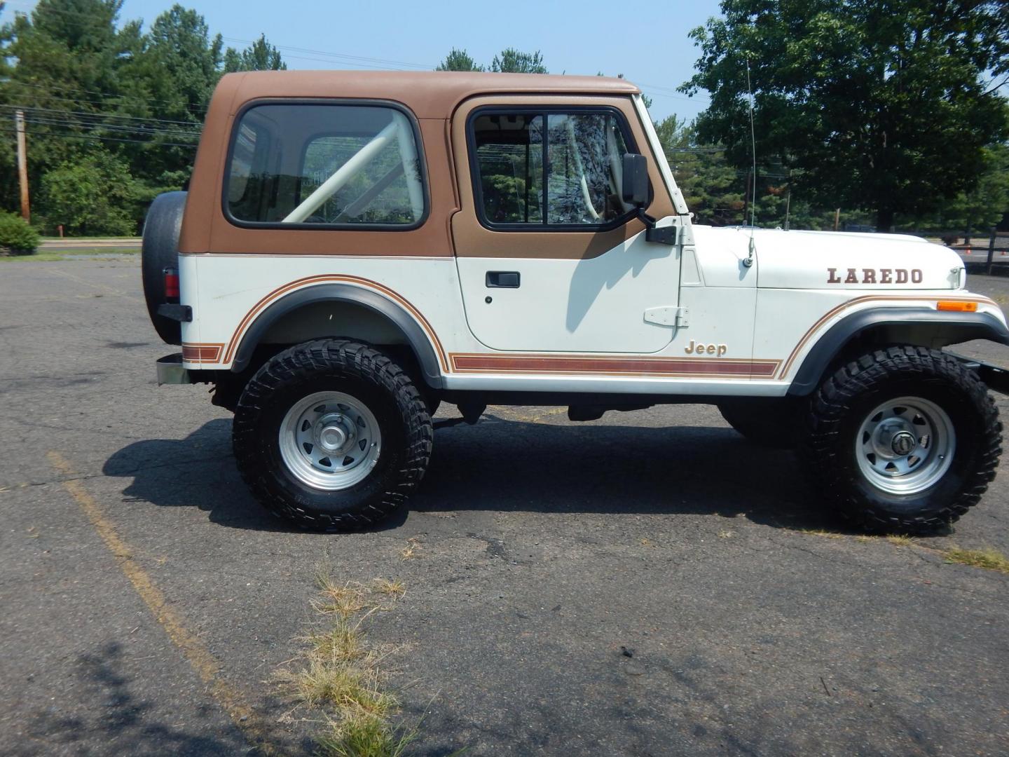 1983 White /Tan Jeep CJ7 Base (1JCCN87E0DT) with an 4.2L L6 OHV engine, Manual transmission, located at 6528 Lower York Road, New Hope, PA, 18938, (215) 862-9555, 40.358707, -74.977882 - Here we have a 1983 CJ-7 Laredo with a 4.2L straight six putting power to an 4x4 manual transmission. This CJ has saddle colored leather seats, sliding windows, hard top, lockers on both axles, new muffler, new bearings and 15 inch alloy wheels with 4 Mickey Thompson tires. This vehicle is being off - Photo#4