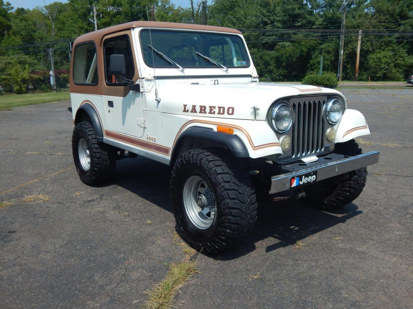 1983 White /Tan Jeep CJ7 Base (1JCCN87E0DT) with an 4.2L L6 OHV engine, Manual transmission, located at 6528 Lower York Road, New Hope, PA, 18938, (215) 862-9555, 40.358707, -74.977882 - Here we have a 1983 CJ-7 Laredo with a 4.2L straight six putting power to an 4x4 manual transmission. This CJ has saddle colored leather seats, sliding windows, hard top, lockers on both axles, new muffler, new bearings and 15 inch alloy wheels with 4 Mickey Thompson tires. This vehicle is being off - Photo#5