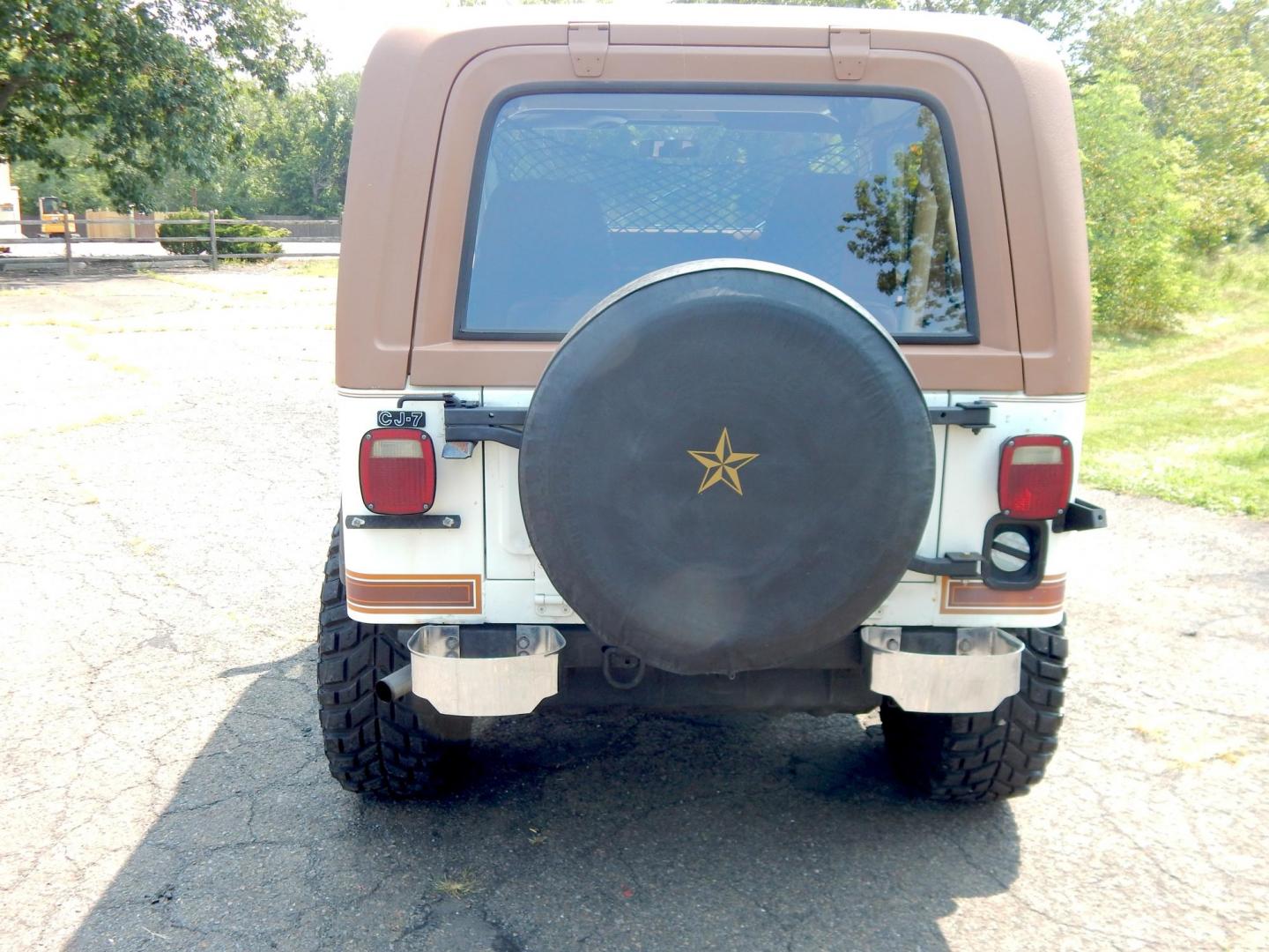 1983 White /Tan Jeep CJ7 Base (1JCCN87E0DT) with an 4.2L L6 OHV engine, Manual transmission, located at 6528 Lower York Road, New Hope, PA, 18938, (215) 862-9555, 40.358707, -74.977882 - Here we have a 1983 CJ-7 Laredo with a 4.2L straight six putting power to an 4x4 manual transmission. This CJ has saddle colored leather seats, sliding windows, hard top, lockers on both axles, new muffler, new bearings and 15 inch alloy wheels with 4 Mickey Thompson tires. This vehicle is being off - Photo#7