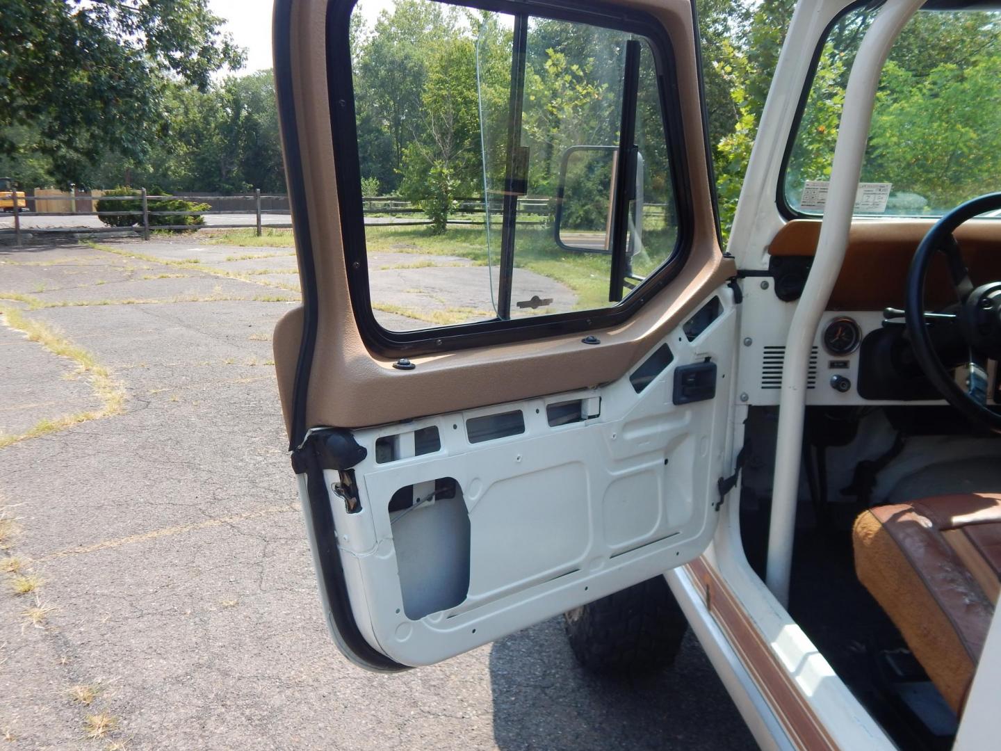 1983 White /Tan Jeep CJ7 Base (1JCCN87E0DT) with an 4.2L L6 OHV engine, Manual transmission, located at 6528 Lower York Road, New Hope, PA, 18938, (215) 862-9555, 40.358707, -74.977882 - Here we have a 1983 CJ-7 Laredo with a 4.2L straight six putting power to an 4x4 manual transmission. This CJ has saddle colored leather seats, sliding windows, hard top, lockers on both axles, new muffler, new bearings and 15 inch alloy wheels with 4 Mickey Thompson tires. This vehicle is being off - Photo#8