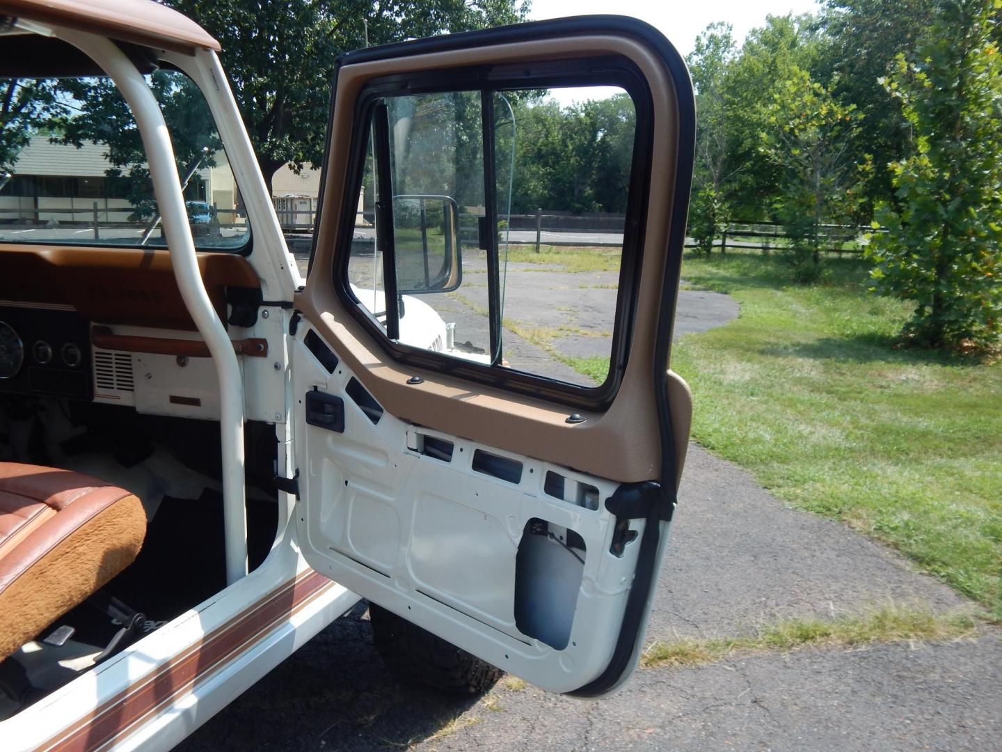 1983 White /Tan Jeep CJ7 Base (1JCCN87E0DT) with an 4.2L L6 OHV engine, Manual transmission, located at 6528 Lower York Road, New Hope, PA, 18938, (215) 862-9555, 40.358707, -74.977882 - Here we have a 1983 CJ-7 Laredo with a 4.2L straight six putting power to an 4x4 manual transmission. This CJ has saddle colored leather seats, sliding windows, hard top, lockers on both axles, new muffler, new bearings and 15 inch alloy wheels with 4 Mickey Thompson tires. This vehicle is being off - Photo#10