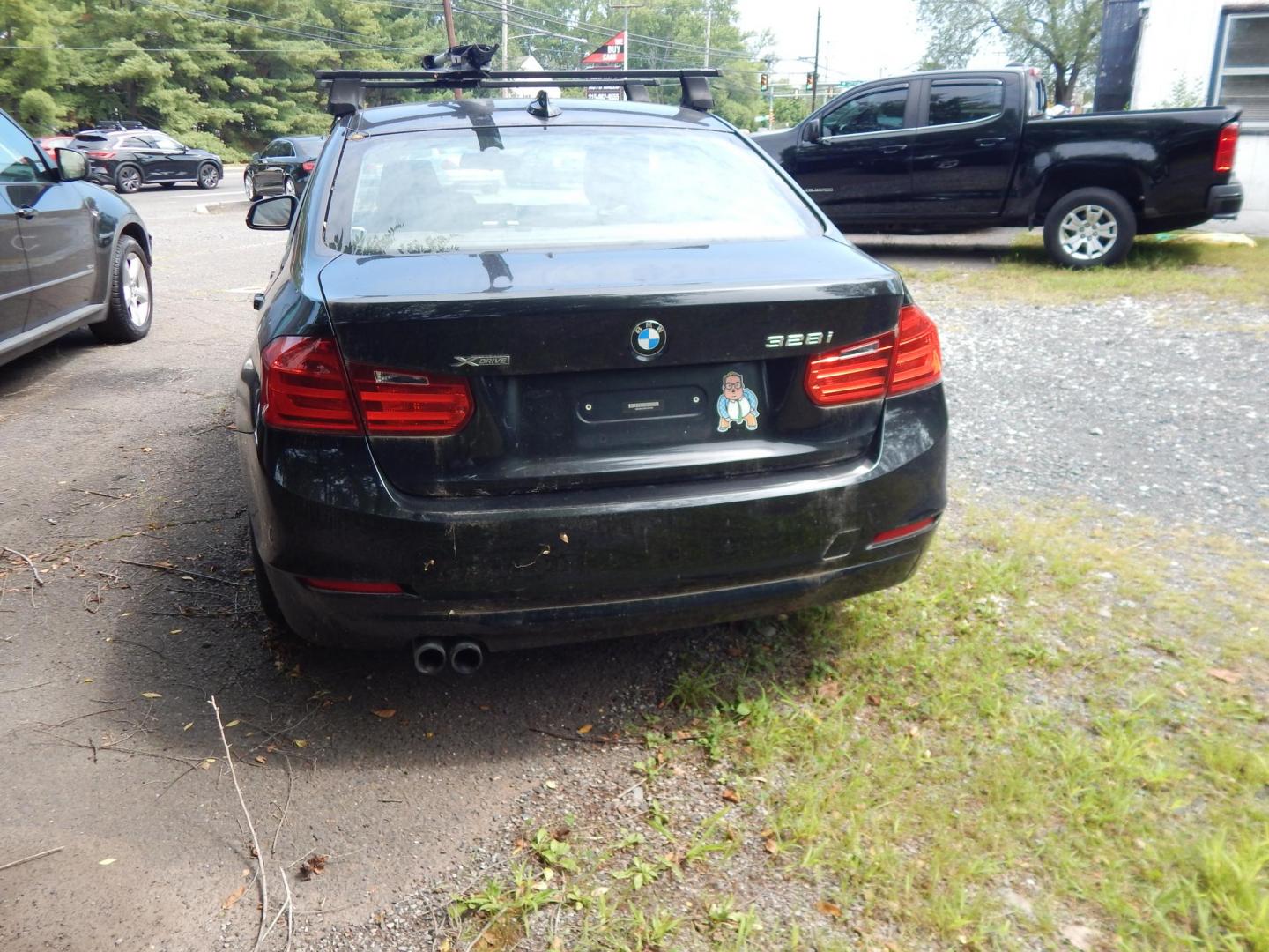 2013 Black /BLACK BMW 3-Series 328i xDrive Sedan - SULEV (WBA3B5C56DF) with an 2.0L L4 DOHC 16V engine, Auto transmission, located at 6528 Lower York Road, New Hope, PA, 18938, (215) 862-9555, 40.358707, -74.977882 - 2013 BMW 328 I X drive..2.0 Liter Turbo that needs an engine, AWD, tilt/cruise, dual power seats, elk leather, power moonroof, windows, mirrors, central locking system, heated seats, AM/FM/CD sound, 17" factory alloy wheels 3 owners, 23 service records and no accidents. Thule roof rack. Selling as-i - Photo#3