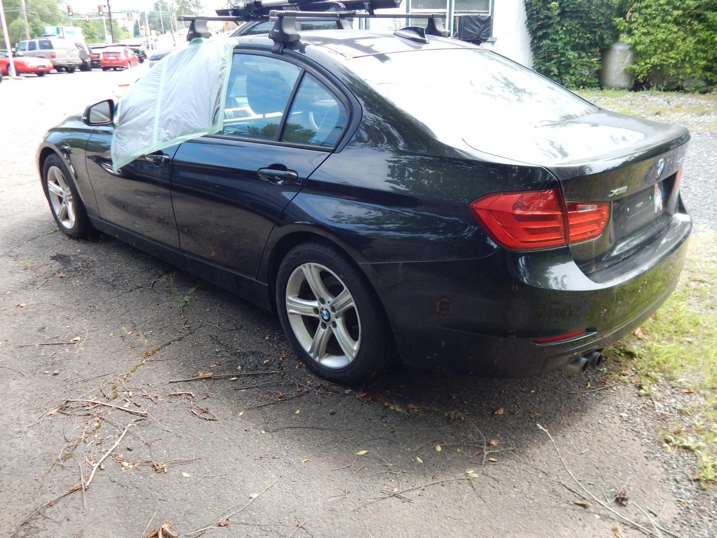 2013 Black /BLACK BMW 3-Series 328i xDrive Sedan - SULEV (WBA3B5C56DF) with an 2.0L L4 DOHC 16V engine, Auto transmission, located at 6528 Lower York Road, New Hope, PA, 18938, (215) 862-9555, 40.358707, -74.977882 - 2013 BMW 328 I X drive..2.0 Liter Turbo that needs an engine, AWD, tilt/cruise, dual power seats, elk leather, power moonroof, windows, mirrors, central locking system, heated seats, AM/FM/CD sound, 17" factory alloy wheels 3 owners, 23 service records and no accidents. Thule roof rack. Selling as-i - Photo#4