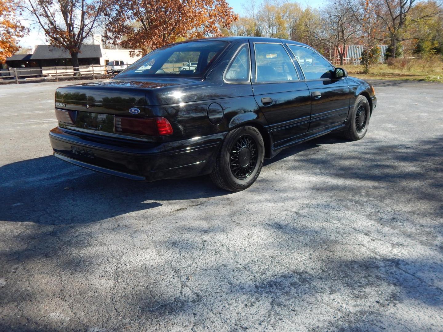 1990 Black /Black Ford Taurus SHO (1FACP54Y1LA) with an 3.0L V6 DOHC 24V engine, 5-Speed Manual Overdrive transmission, located at 6528 Lower York Road, New Hope, PA, 18938, (215) 862-9555, 40.358707, -74.977882 - Here we have a very nicely kept Ford Taurus SHO with a 3.0L V6 putting power to the front wheels via a 5 speed manual transmission. Options include: black leather, power seats, aftermarket JVC radio, heat and AC controls, sunroof, cruise control, tilt steering wheel, power windows/locks/mirrors, pow - Photo#2