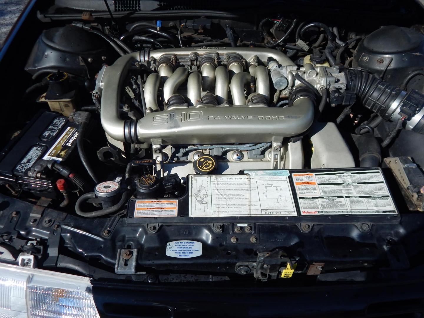 1990 Black /Black Ford Taurus SHO (1FACP54Y1LA) with an 3.0L V6 DOHC 24V engine, 5-Speed Manual Overdrive transmission, located at 6528 Lower York Road, New Hope, PA, 18938, (215) 862-9555, 40.358707, -74.977882 - Here we have a very nicely kept Ford Taurus SHO with a 3.0L V6 putting power to the front wheels via a 5 speed manual transmission. Options include: black leather, power seats, aftermarket JVC radio, heat and AC controls, sunroof, cruise control, tilt steering wheel, power windows/locks/mirrors, pow - Photo#15