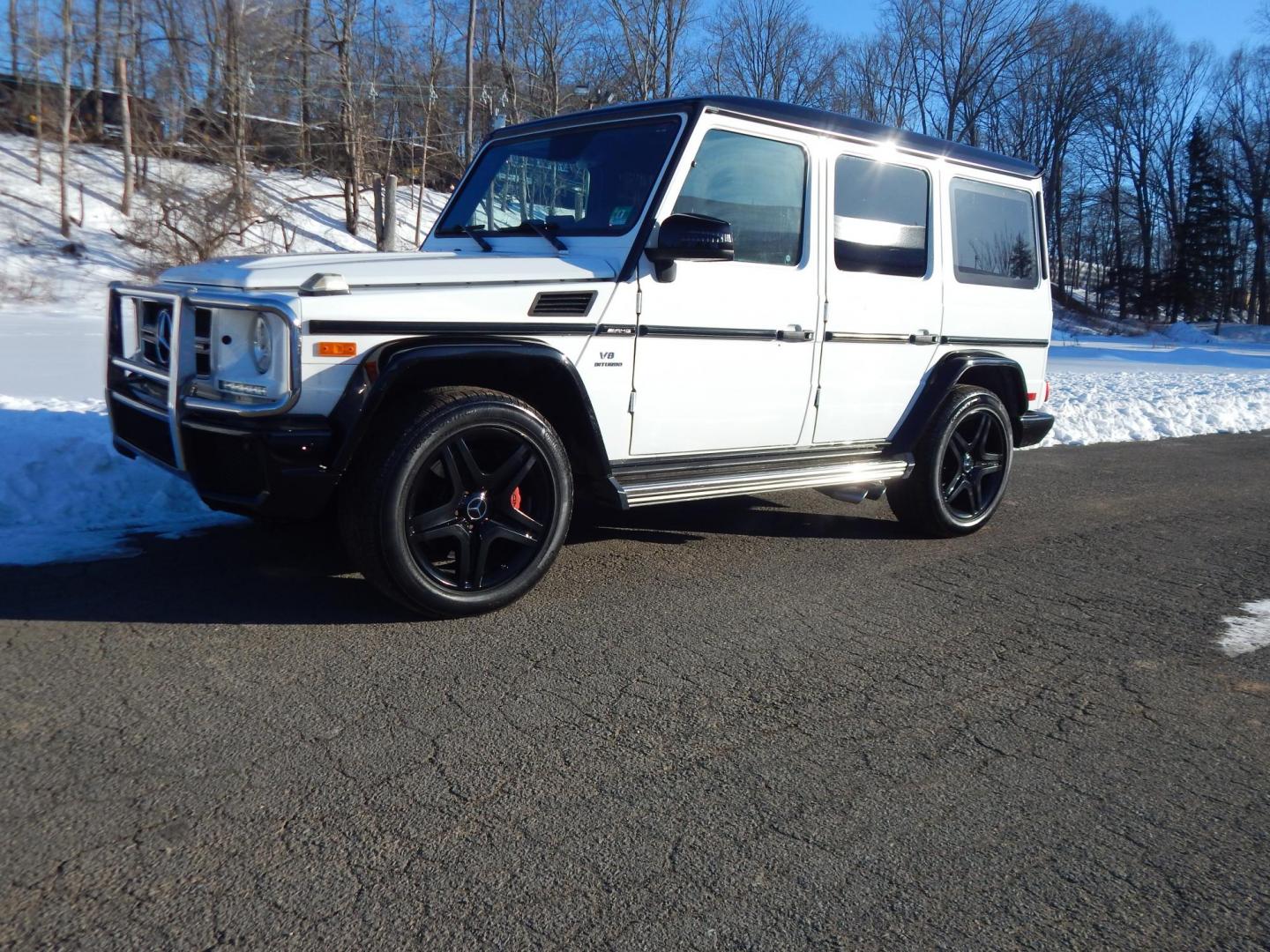 2018 White /black Mercedes-Benz G-Class G63 AMG 4MATIC (WDCYC7DH5JX) with an 5.5L V8 SOHC 24V engine, Automatic transmission, located at 6528 Lower York Road, New Hope, PA, 18938, (215) 862-9555, 40.358707, -74.977882 - Here we have a very cool 2018 Mercedes G63 AMG. This AMG does have a lemon law/buy back title. The problem was solved in 2021 at 32k miles when Mercedes replaced the cylinder head! This G63 has white paint with a black roof, black and red leather interior with carbon fiber trim, dual power heated an - Photo#30
