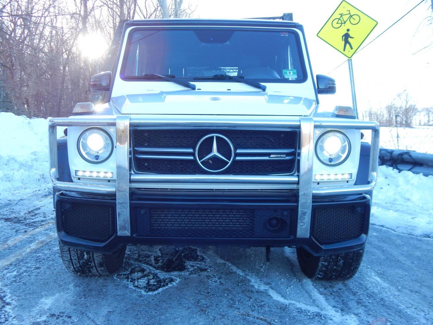 2018 White /black Mercedes-Benz G-Class G63 AMG 4MATIC (WDCYC7DH5JX) with an 5.5L V8 SOHC 24V engine, Automatic transmission, located at 6528 Lower York Road, New Hope, PA, 18938, (215) 862-9555, 40.358707, -74.977882 - Here we have a very cool 2018 Mercedes G63 AMG. This AMG does have a lemon law/buy back title. The problem was solved in 2021 at 32k miles when Mercedes replaced the cylinder head! This G63 has white paint with a black roof, black and red leather interior with carbon fiber trim, dual power heated an - Photo#38