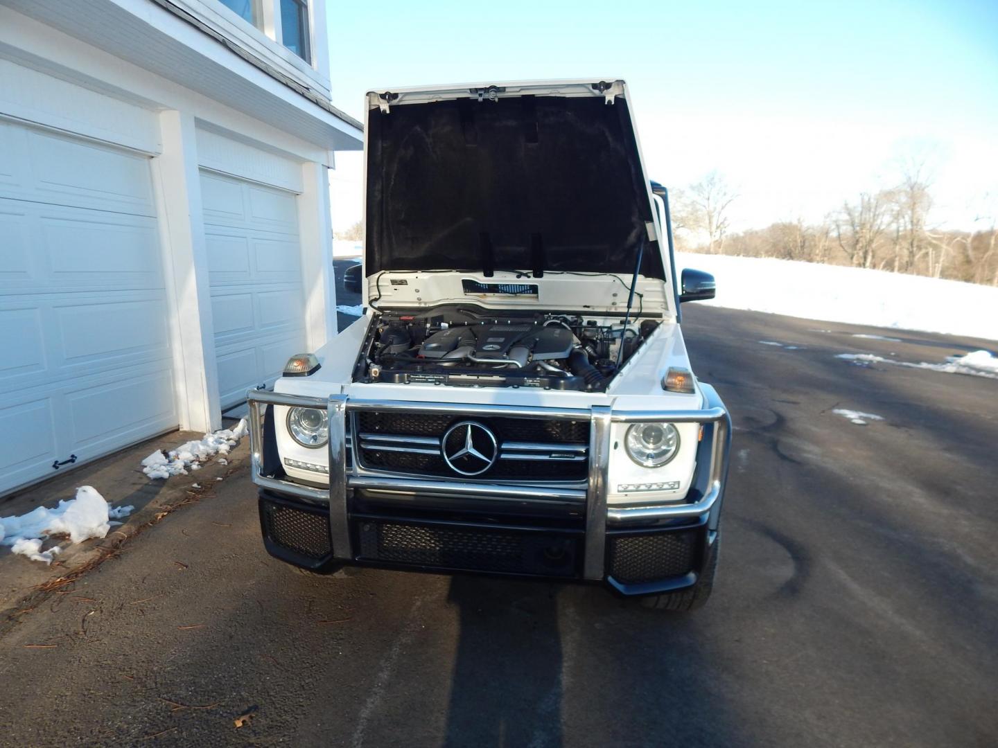 2018 White /black Mercedes-Benz G-Class G63 AMG 4MATIC (WDCYC7DH5JX) with an 5.5L V8 SOHC 24V engine, Automatic transmission, located at 6528 Lower York Road, New Hope, PA, 18938, (215) 862-9555, 40.358707, -74.977882 - Here we have a very cool 2018 Mercedes G63 AMG. This AMG does have a lemon law/buy back title. The problem was solved in 2021 at 32k miles when Mercedes replaced the cylinder head! This G63 has white paint with a black roof, black and red leather interior with carbon fiber trim, dual power heated an - Photo#40