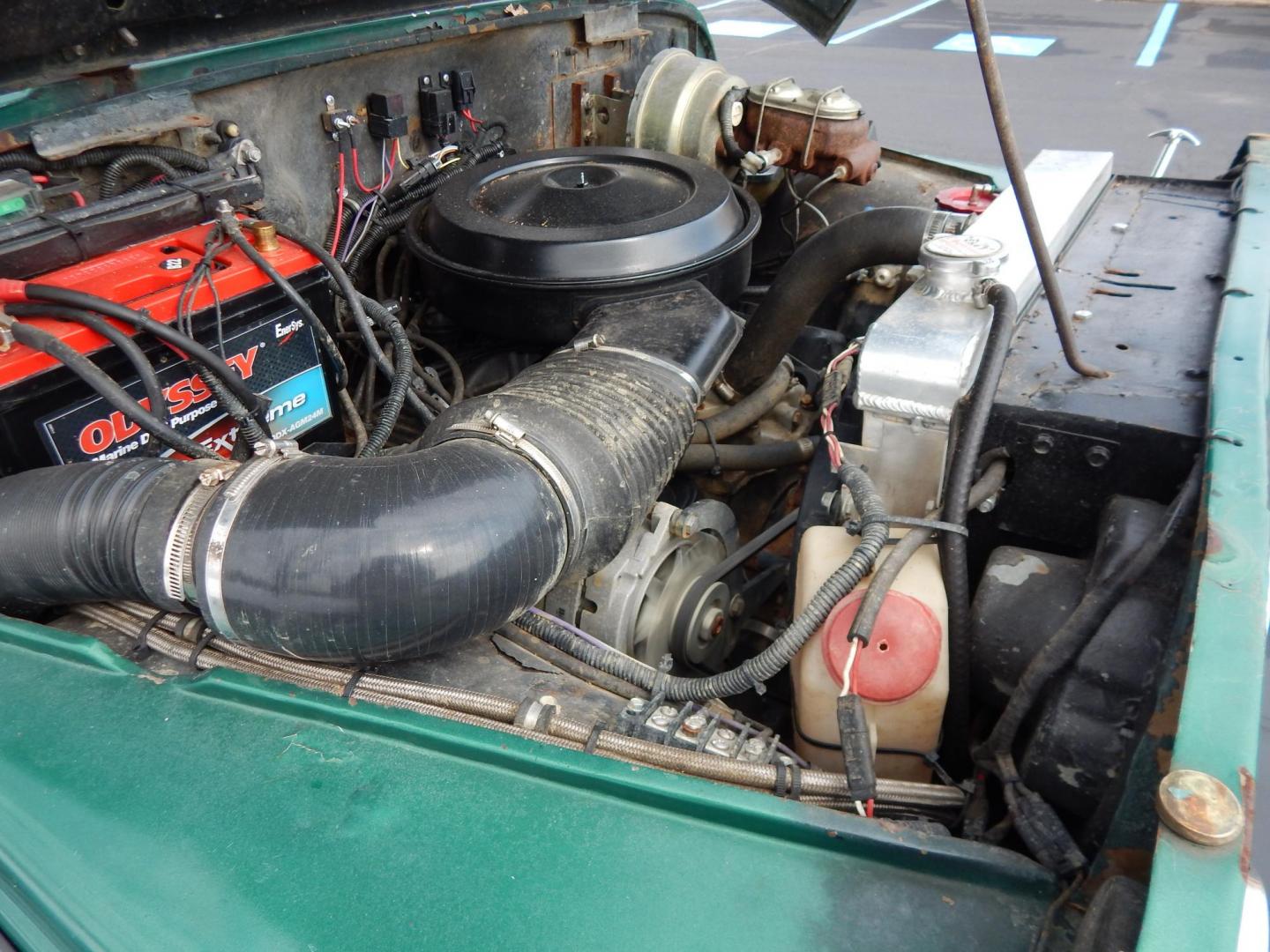 1970 Green /Black Jeepster Commando Commando (8705H176806) with an V8 engine, Automatic transmission, located at 6528 Lower York Road, New Hope, PA, 18938, (215) 862-9555, 40.358707, -74.977882 - Here we have a 1970 Jeepster Commando with a V8 engine swap and automatic transmission swap. This Jeepster has an edelbrock intake and a Holly sniper EFI. Black soft top. Starts right up every time for us. Fun vehicle to ride around town in or hit the trails. We are selling this vehicle on consignme - Photo#14