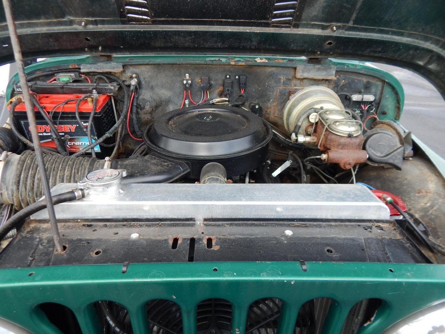 1970 Green /Black Jeepster Commando Commando (8705H176806) with an V8 engine, Automatic transmission, located at 6528 Lower York Road, New Hope, PA, 18938, (215) 862-9555, 40.358707, -74.977882 - Here we have a 1970 Jeepster Commando with a V8 engine swap and automatic transmission swap. This Jeepster has an edelbrock intake and a Holly sniper EFI. Black soft top. Starts right up every time for us. Fun vehicle to ride around town in or hit the trails. We are selling this vehicle on consignme - Photo#15