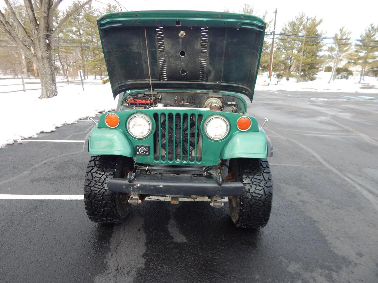 1970 Green /Black Jeepster Commando Commando (8705H176806) with an V8 engine, Automatic transmission, located at 6528 Lower York Road, New Hope, PA, 18938, (215) 862-9555, 40.358707, -74.977882 - Here we have a 1970 Jeepster Commando with a V8 engine swap and automatic transmission swap. This Jeepster has an edelbrock intake and a Holly sniper EFI. Black soft top. Starts right up every time for us. Fun vehicle to ride around town in or hit the trails. We are selling this vehicle on consignme - Photo#16