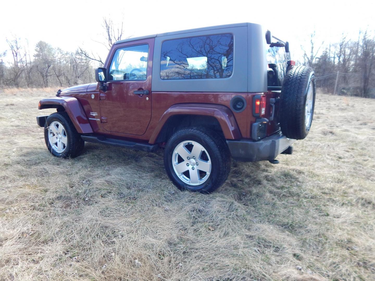 2010 Burgundy /Gray Jeep Wrangler Sahara 4WD (1J4AA5D11AL) with an 3.8L V6 OHV 12V engine, Manual transmission, located at 6528 Lower York Road, New Hope, PA, 18938, (215) 862-9555, 40.358707, -74.977882 - Here we have a very fun Jeep Wrangler with a 3.8L V6 putting power to the ground via a 6 speed manual 4x4 transmission. Options include: gray cloth seats, manual moving seats, heat, A/C, AM/FM/CD/SAT/AUX radio, 3 piece removable hard top, power windows and power locks, cruise control, tilt steering - Photo#2