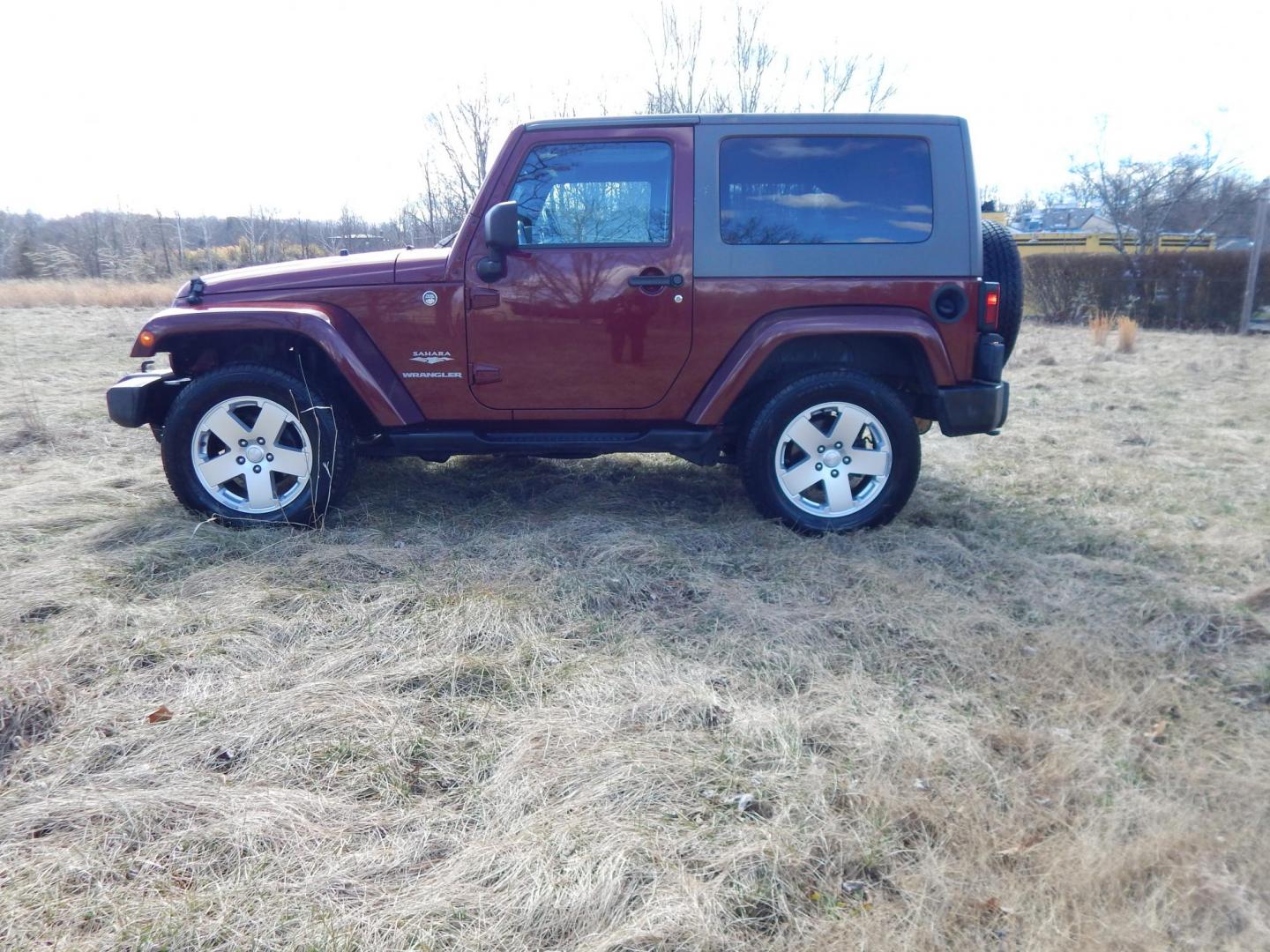 2010 Burgundy /Gray Jeep Wrangler Sahara 4WD (1J4AA5D11AL) with an 3.8L V6 OHV 12V engine, Manual transmission, located at 6528 Lower York Road, New Hope, PA, 18938, (215) 862-9555, 40.358707, -74.977882 - Here we have a very fun Jeep Wrangler with a 3.8L V6 putting power to the ground via a 6 speed manual 4x4 transmission. Options include: gray cloth seats, manual moving seats, heat, A/C, AM/FM/CD/SAT/AUX radio, 3 piece removable hard top, power windows and power locks, cruise control, tilt steering - Photo#1