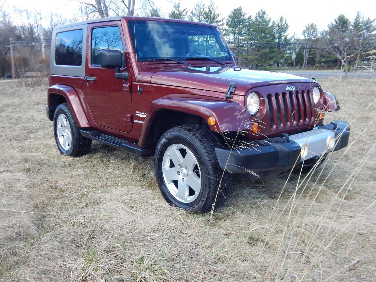 2010 Burgundy /Gray Jeep Wrangler Sahara 4WD (1J4AA5D11AL) with an 3.8L V6 OHV 12V engine, Manual transmission, located at 6528 Lower York Road, New Hope, PA, 18938, (215) 862-9555, 40.358707, -74.977882 - Here we have a very fun Jeep Wrangler with a 3.8L V6 putting power to the ground via a 6 speed manual 4x4 transmission. Options include: gray cloth seats, manual moving seats, heat, A/C, AM/FM/CD/SAT/AUX radio, 3 piece removable hard top, power windows and power locks, cruise control, tilt steering - Photo#5