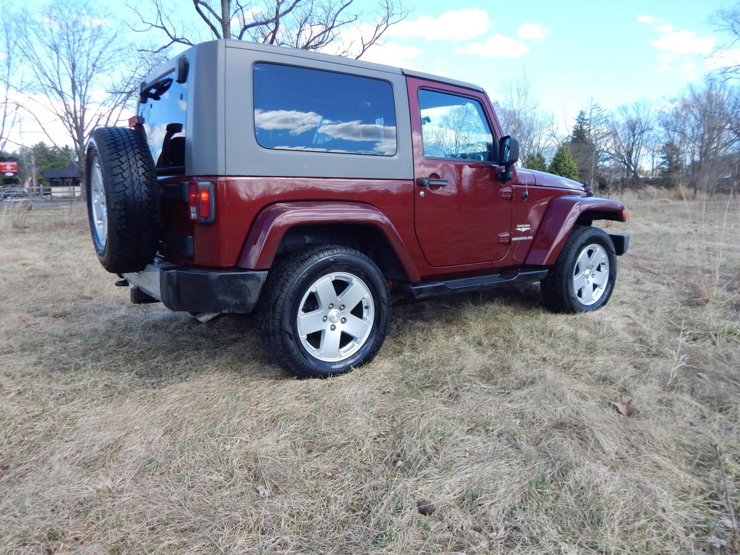 2010 Burgundy /Gray Jeep Wrangler Sahara 4WD (1J4AA5D11AL) with an 3.8L V6 OHV 12V engine, Manual transmission, located at 6528 Lower York Road, New Hope, PA, 18938, (215) 862-9555, 40.358707, -74.977882 - Here we have a very fun Jeep Wrangler with a 3.8L V6 putting power to the ground via a 6 speed manual 4x4 transmission. Options include: gray cloth seats, manual moving seats, heat, A/C, AM/FM/CD/SAT/AUX radio, 3 piece removable hard top, power windows and power locks, cruise control, tilt steering - Photo#3