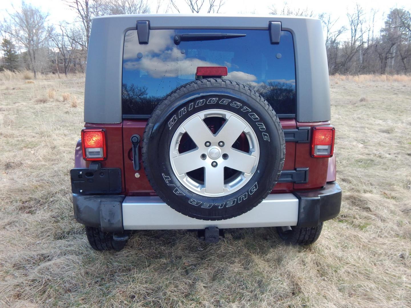 2010 Burgundy /Gray Jeep Wrangler Sahara 4WD (1J4AA5D11AL) with an 3.8L V6 OHV 12V engine, Manual transmission, located at 6528 Lower York Road, New Hope, PA, 18938, (215) 862-9555, 40.358707, -74.977882 - Here we have a very fun Jeep Wrangler with a 3.8L V6 putting power to the ground via a 6 speed manual 4x4 transmission. Options include: gray cloth seats, manual moving seats, heat, A/C, AM/FM/CD/SAT/AUX radio, 3 piece removable hard top, power windows and power locks, cruise control, tilt steering - Photo#7