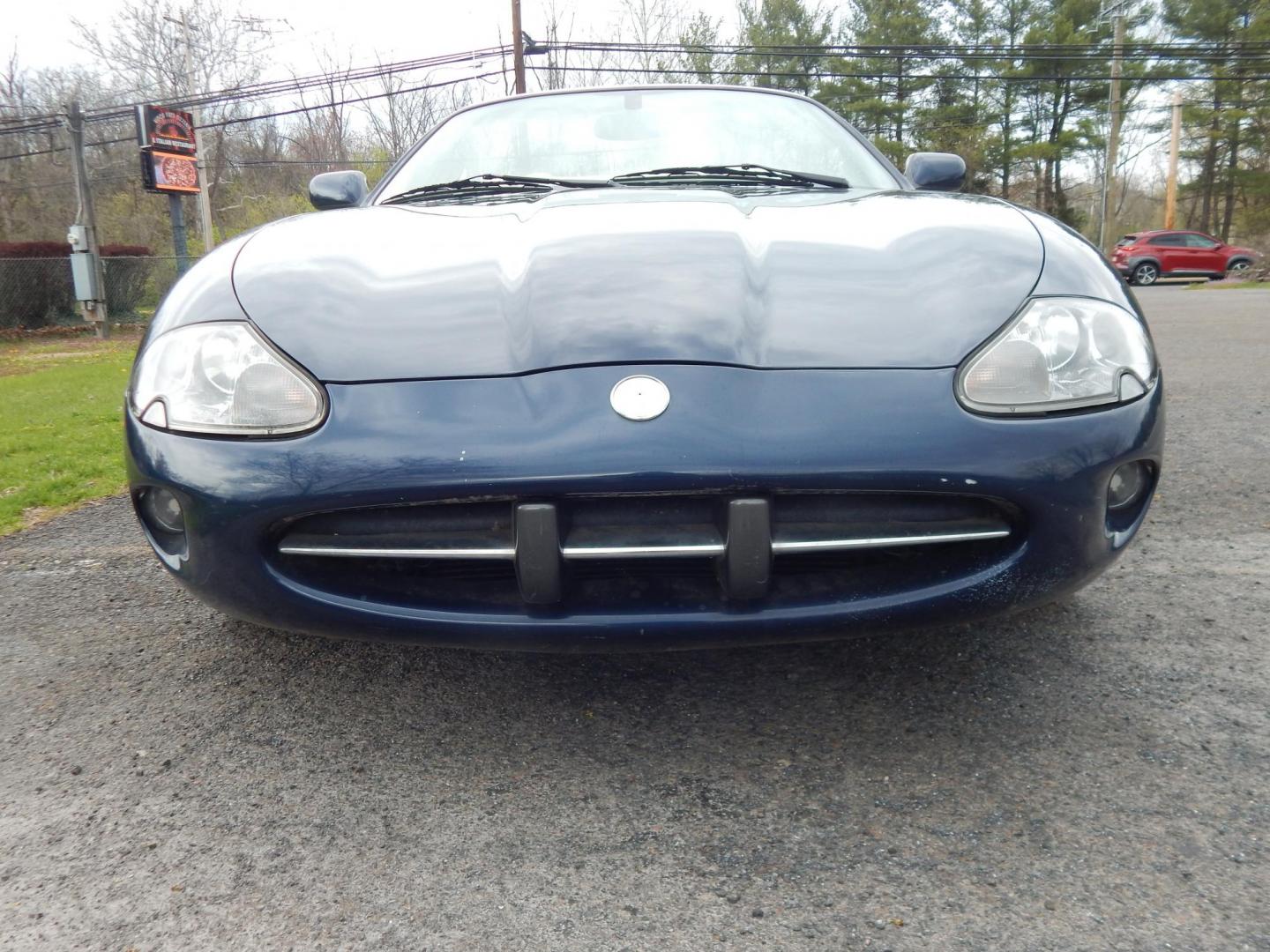 2000 Blue Jaguar XK8 Convertible (SAJJA42C6YN) with an 4.0L V8 DOHC 32V engine, 5-Speed Automatic Overdrive transmission, located at 6528 Lower York Road, New Hope, PA, 18938, (215) 862-9555, 40.358707, -74.977882 - 2000 Jaguar XK 8. Roadster......8 cylinder engine runs well, automatic transmission shifts on time, this is a 2 owner automobile showing 37 service records on a clean car fax. Although the body and interior are a little rough around, we have priced this Jag for someone to have a semi collectable au - Photo#5