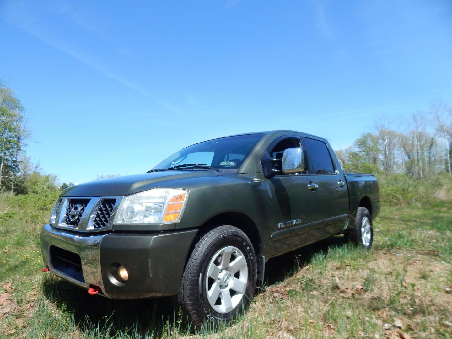2005 Green /Gray Nissan Titan LE Crew Cab 4WD (1N6AA07B75N) with an 5.6L V8 DOHC 32V engine, 5-Speed Automatic Overdrive transmission, located at 6528 Lower York Road, New Hope, PA, 18938, (215) 862-9555, 40.358707, -74.977882 - Here we have a 2005 Nissan Titan with a 5.6L V8 putting power to the ground via a 4x4 automatic transmission. Options include: gray leather, power seats, heat and AC, heated front seats, aftermarket Sony radio, cruise control, tilt steering wheel, memory drivers seat, power windows/locks/mirrors, so - Photo#1
