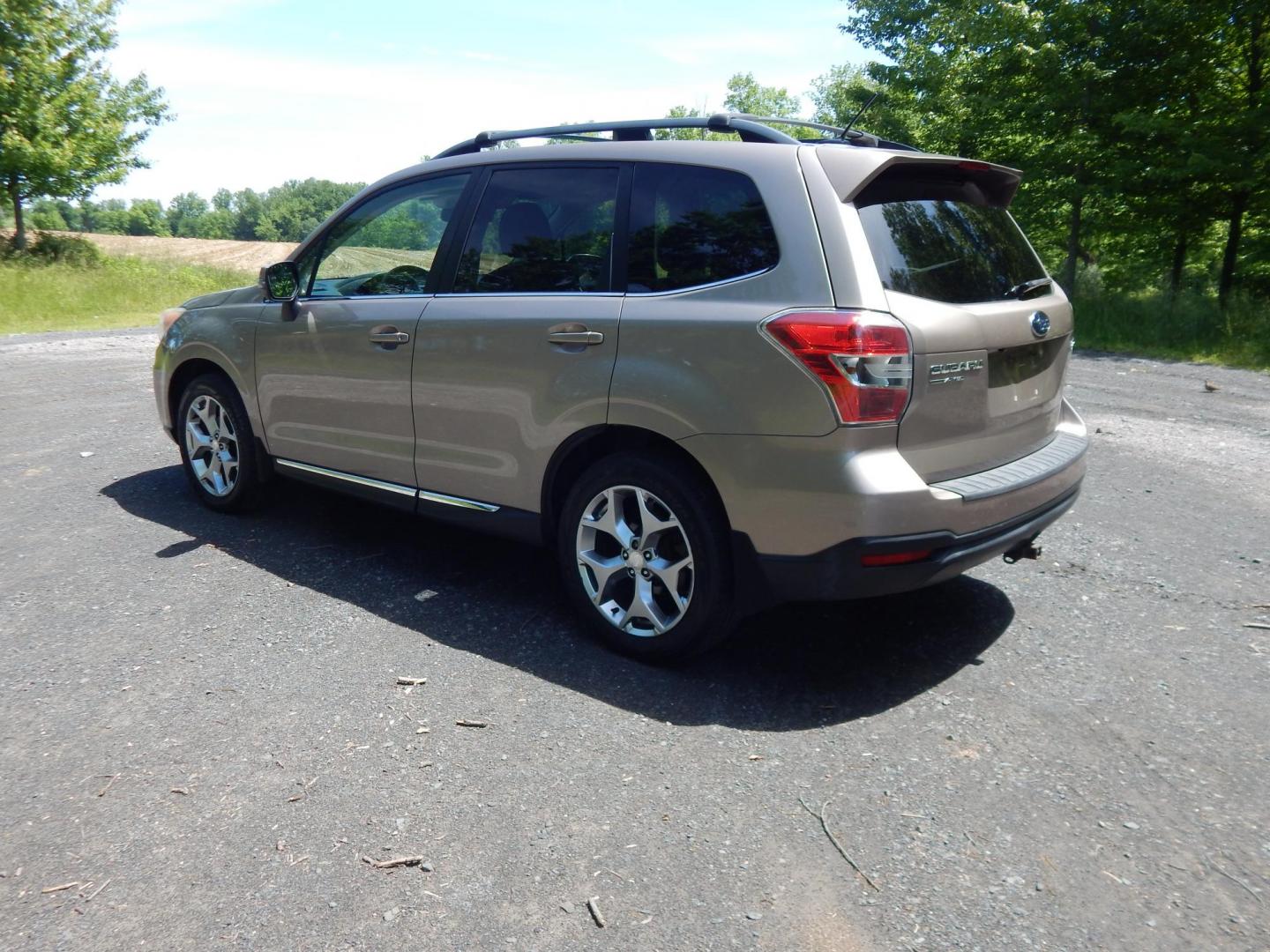 2015 Gold /Black Subaru Forester 2.5i Touring (JF2SJAWC8FH) with an 2.5L H4 SOHC 16V engine, 6-Speed Automatic transmission, located at 6528 Lower York Road, New Hope, PA, 18938, (215) 862-9555, 40.358707, -74.977882 - Here we have a Subaru Forester with a 2.5 L 4 cylinder engine putting power to all four wheels via an automatic transmission. Options include: black leather, power drivers seat, heated front seat, dual climate controls, AM/FM/XM/DISC/BLUETOOTH, tilt steering wheel, cruise control, Harman/Kardon spea - Photo#2