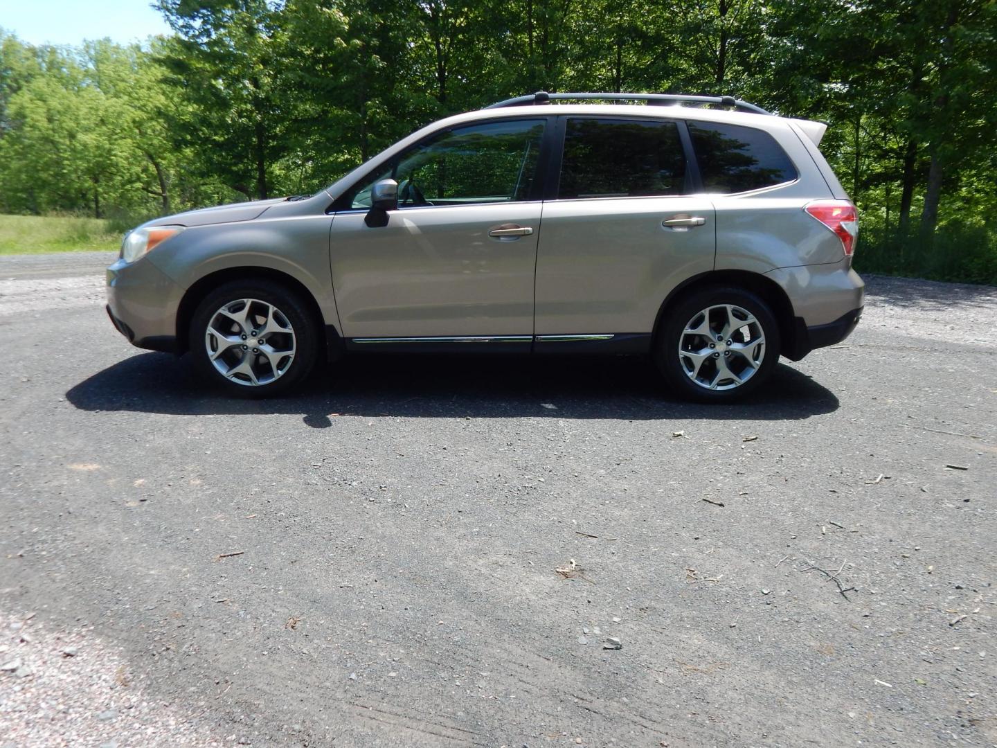 2015 Gold /Black Subaru Forester 2.5i Touring (JF2SJAWC8FH) with an 2.5L H4 SOHC 16V engine, 6-Speed Automatic transmission, located at 6528 Lower York Road, New Hope, PA, 18938, (215) 862-9555, 40.358707, -74.977882 - Here we have a Subaru Forester with a 2.5 L 4 cylinder engine putting power to all four wheels via an automatic transmission. Options include: black leather, power drivers seat, heated front seat, dual climate controls, AM/FM/XM/DISC/BLUETOOTH, tilt steering wheel, cruise control, Harman/Kardon spea - Photo#1