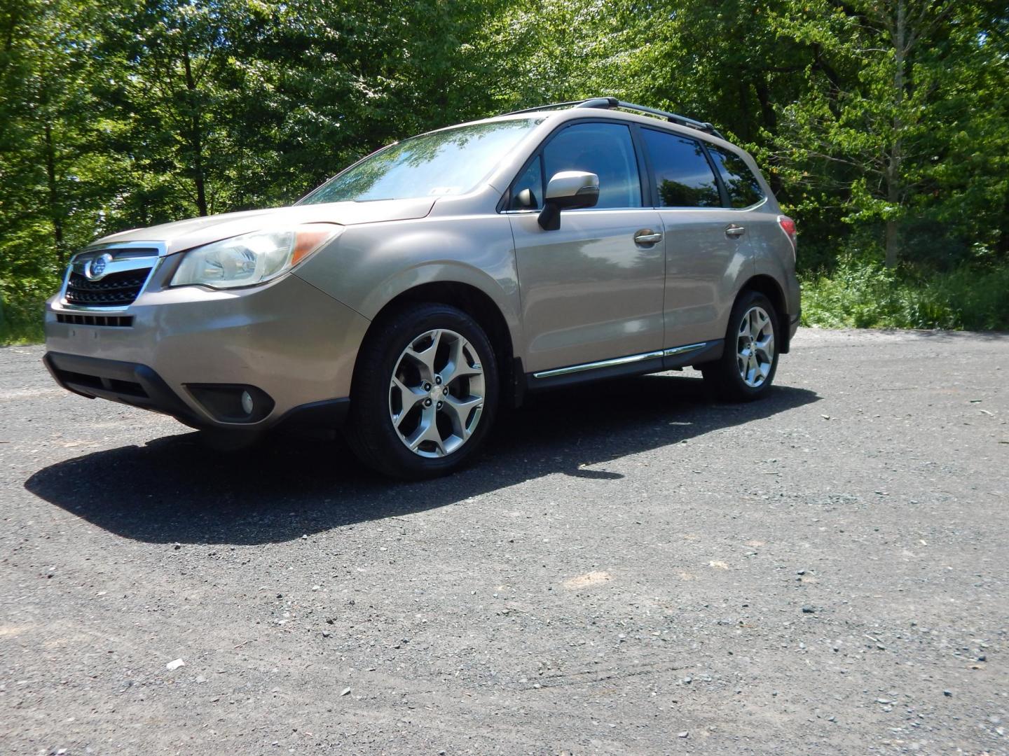 2015 Gold /Black Subaru Forester 2.5i Touring (JF2SJAWC8FH) with an 2.5L H4 SOHC 16V engine, 6-Speed Automatic transmission, located at 6528 Lower York Road, New Hope, PA, 18938, (215) 862-9555, 40.358707, -74.977882 - Here we have a Subaru Forester with a 2.5 L 4 cylinder engine putting power to all four wheels via an automatic transmission. Options include: black leather, power drivers seat, heated front seat, dual climate controls, AM/FM/XM/DISC/BLUETOOTH, tilt steering wheel, cruise control, Harman/Kardon spea - Photo#0