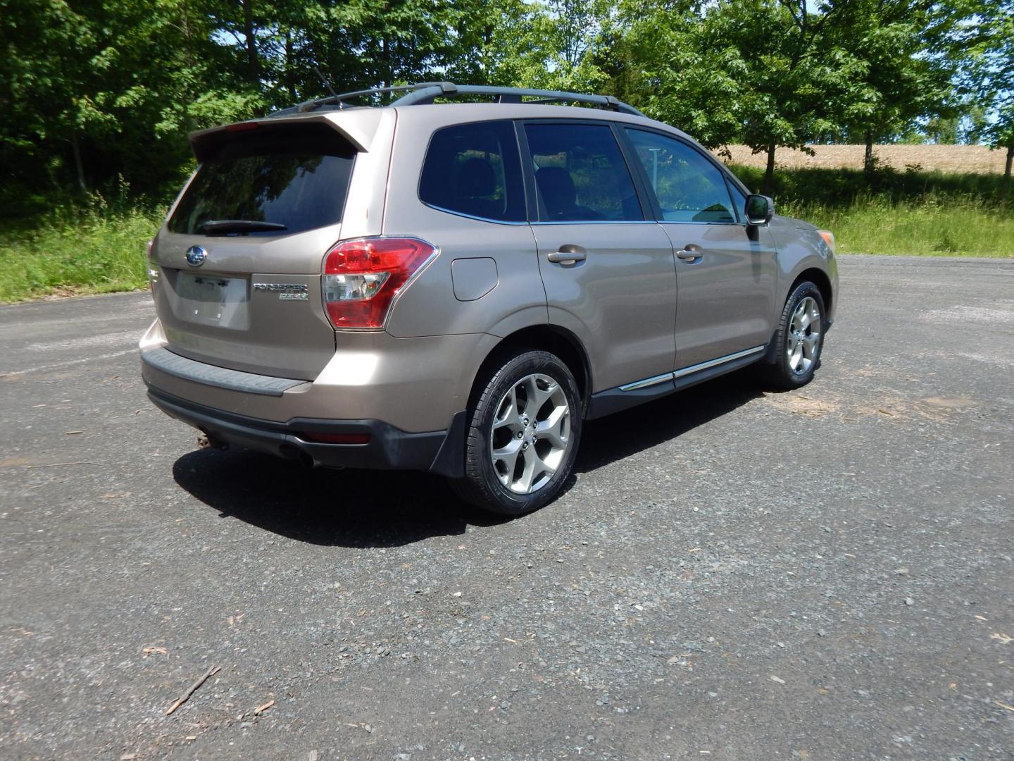 2015 Gold /Black Subaru Forester 2.5i Touring (JF2SJAWC8FH) with an 2.5L H4 SOHC 16V engine, 6-Speed Automatic transmission, located at 6528 Lower York Road, New Hope, PA, 18938, (215) 862-9555, 40.358707, -74.977882 - Here we have a Subaru Forester with a 2.5 L 4 cylinder engine putting power to all four wheels via an automatic transmission. Options include: black leather, power drivers seat, heated front seat, dual climate controls, AM/FM/XM/DISC/BLUETOOTH, tilt steering wheel, cruise control, Harman/Kardon spea - Photo#3
