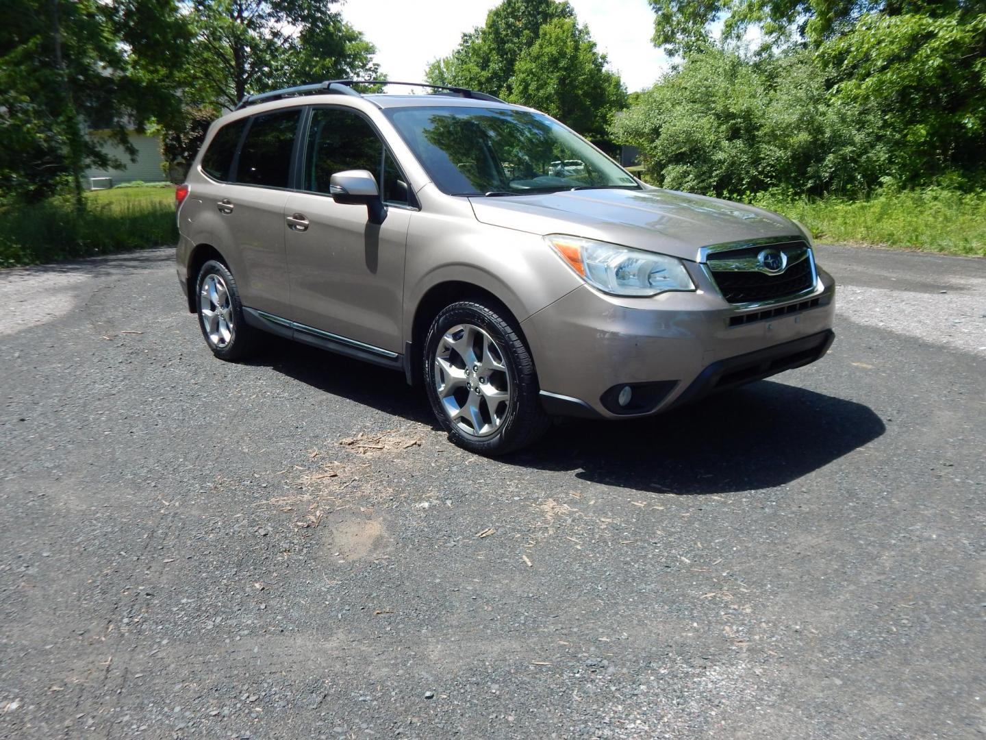 2015 Gold /Black Subaru Forester 2.5i Touring (JF2SJAWC8FH) with an 2.5L H4 SOHC 16V engine, 6-Speed Automatic transmission, located at 6528 Lower York Road, New Hope, PA, 18938, (215) 862-9555, 40.358707, -74.977882 - Here we have a Subaru Forester with a 2.5 L 4 cylinder engine putting power to all four wheels via an automatic transmission. Options include: black leather, power drivers seat, heated front seat, dual climate controls, AM/FM/XM/DISC/BLUETOOTH, tilt steering wheel, cruise control, Harman/Kardon spea - Photo#5