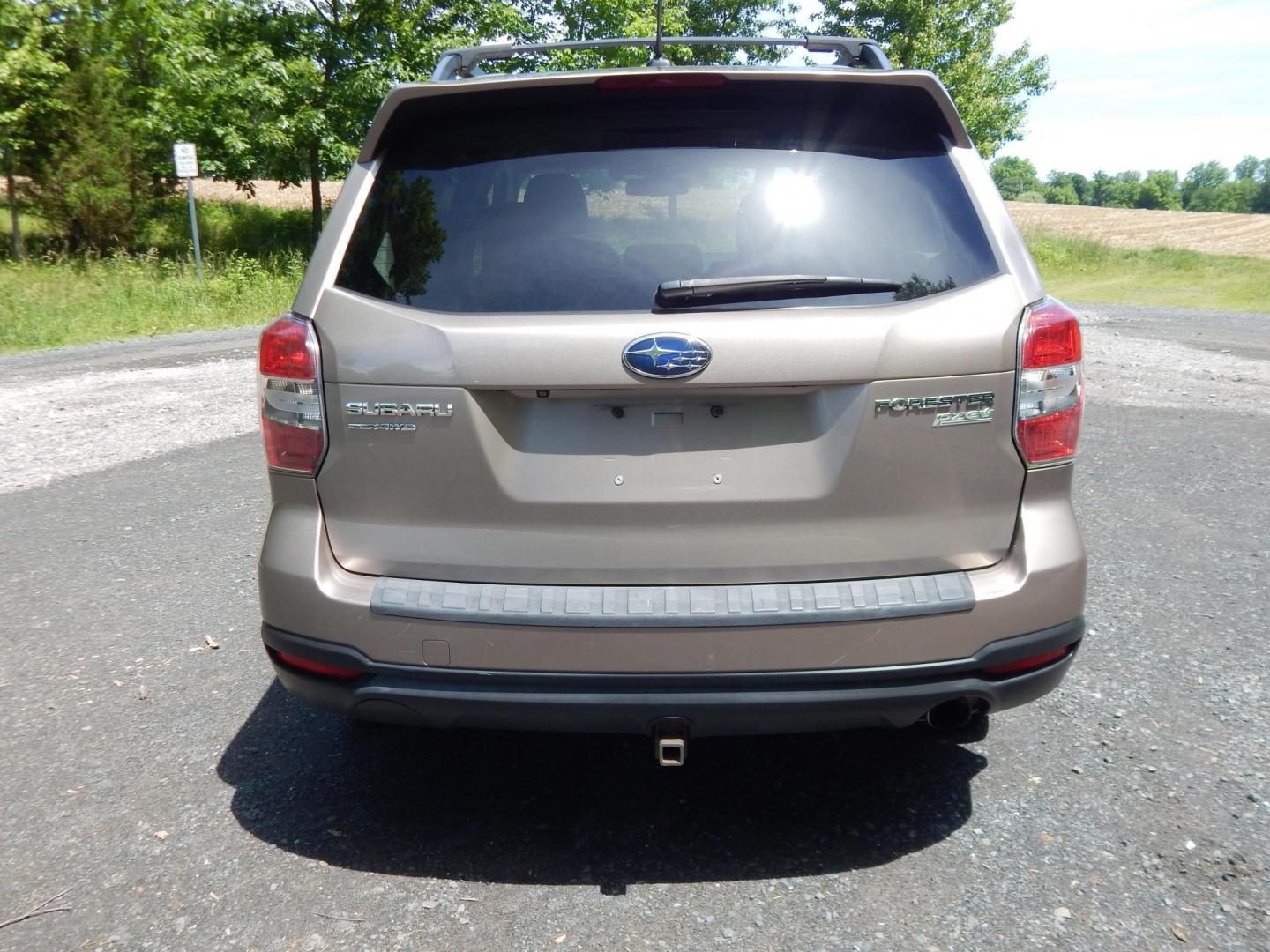 2015 Gold /Black Subaru Forester 2.5i Touring (JF2SJAWC8FH) with an 2.5L H4 SOHC 16V engine, 6-Speed Automatic transmission, located at 6528 Lower York Road, New Hope, PA, 18938, (215) 862-9555, 40.358707, -74.977882 - Here we have a Subaru Forester with a 2.5 L 4 cylinder engine putting power to all four wheels via an automatic transmission. Options include: black leather, power drivers seat, heated front seat, dual climate controls, AM/FM/XM/DISC/BLUETOOTH, tilt steering wheel, cruise control, Harman/Kardon spea - Photo#7