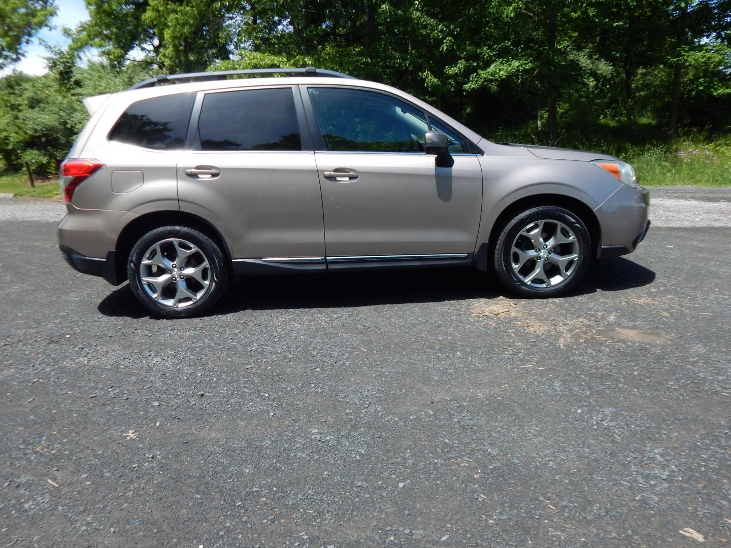 2015 Gold /Black Subaru Forester 2.5i Touring (JF2SJAWC8FH) with an 2.5L H4 SOHC 16V engine, 6-Speed Automatic transmission, located at 6528 Lower York Road, New Hope, PA, 18938, (215) 862-9555, 40.358707, -74.977882 - Here we have a Subaru Forester with a 2.5 L 4 cylinder engine putting power to all four wheels via an automatic transmission. Options include: black leather, power drivers seat, heated front seat, dual climate controls, AM/FM/XM/DISC/BLUETOOTH, tilt steering wheel, cruise control, Harman/Kardon spea - Photo#4