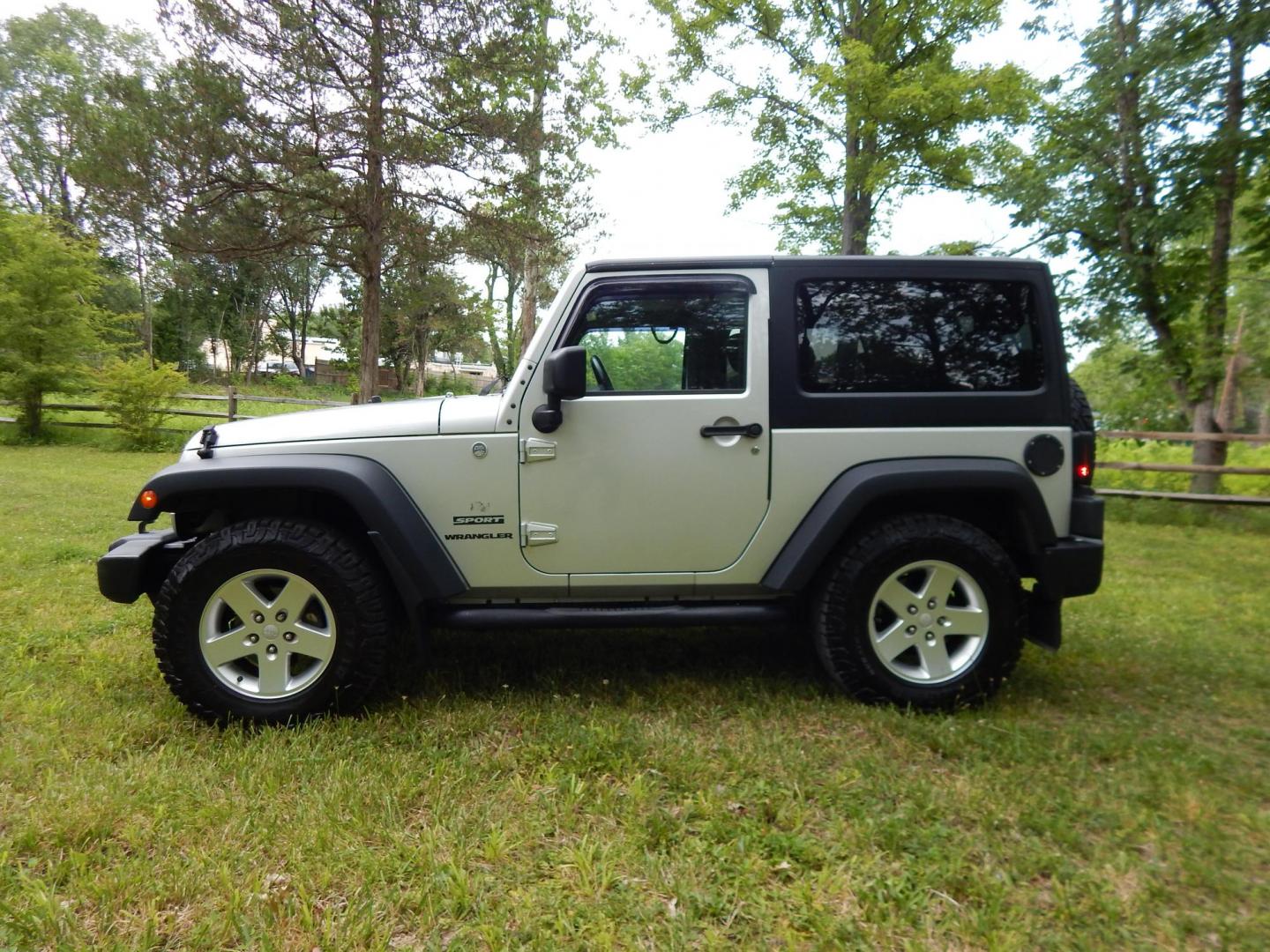 2011 Silver /Black Jeep Wrangler Sport 4WD (1J4AA2D12BL) with an 3.8L V6 OHV 12V engine, Automatic transmission, located at 6528 Lower York Road, New Hope, PA, 18938, (215) 862-9555, 40.358707, -74.977882 - Here we have a 2011 Jeep Wrangler Sport with a 3.8L V6 putting power to an automatic 4x4 transmission. Options include: black cloth, heat and AC, JVC aftermarket radio, cruise control, tilt steering wheel, 3 piece hard top, power windows/locks/mirrors, 17 inch alloy wheels with 4 Goodyear Wrangler t - Photo#1