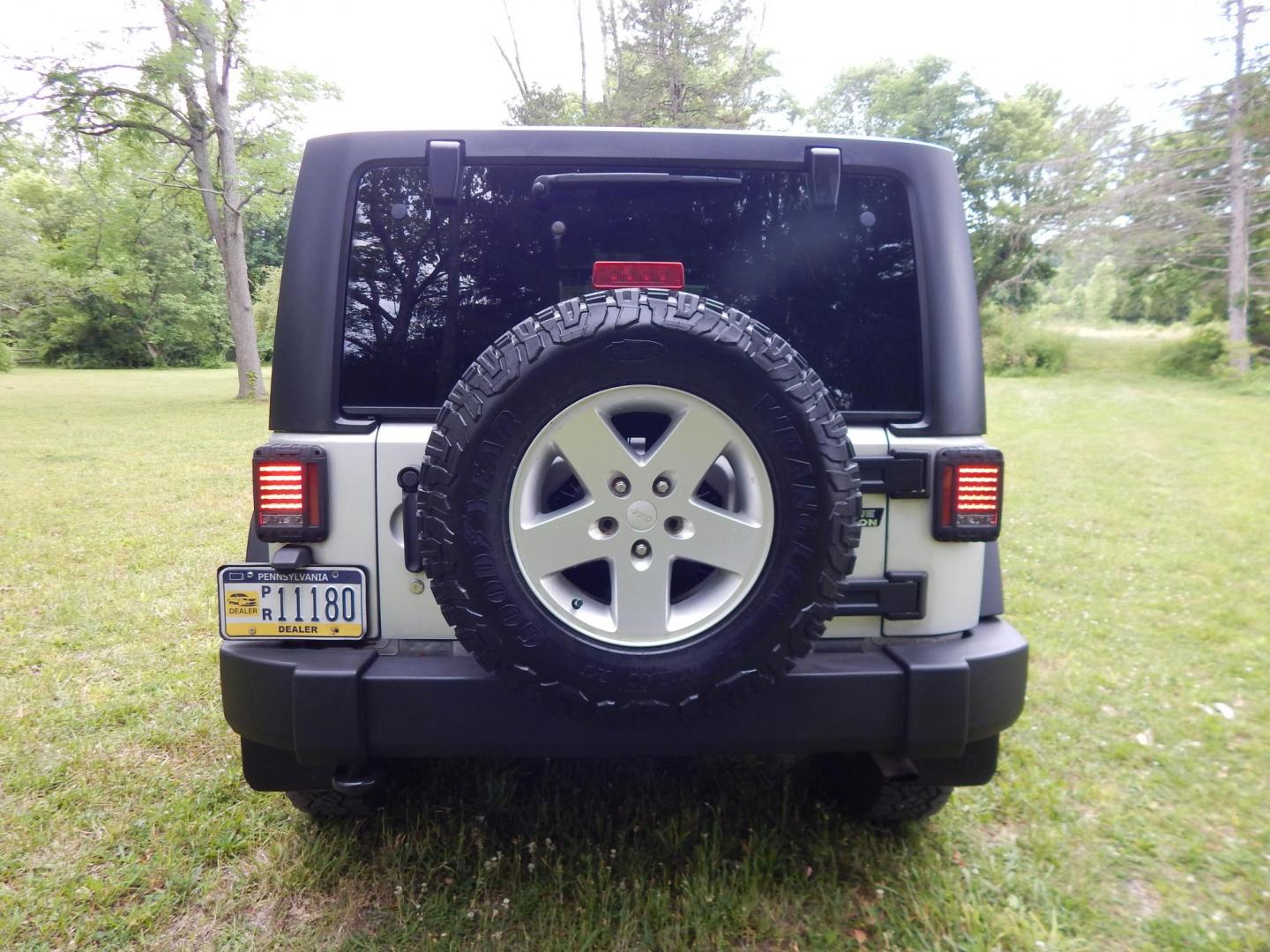2011 Silver /Black Jeep Wrangler Sport 4WD (1J4AA2D12BL) with an 3.8L V6 OHV 12V engine, Automatic transmission, located at 6528 Lower York Road, New Hope, PA, 18938, (215) 862-9555, 40.358707, -74.977882 - Here we have a 2011 Jeep Wrangler Sport with a 3.8L V6 putting power to an automatic 4x4 transmission. Options include: black cloth, heat and AC, JVC aftermarket radio, cruise control, tilt steering wheel, 3 piece hard top, power windows/locks/mirrors, 17 inch alloy wheels with 4 Goodyear Wrangler t - Photo#3