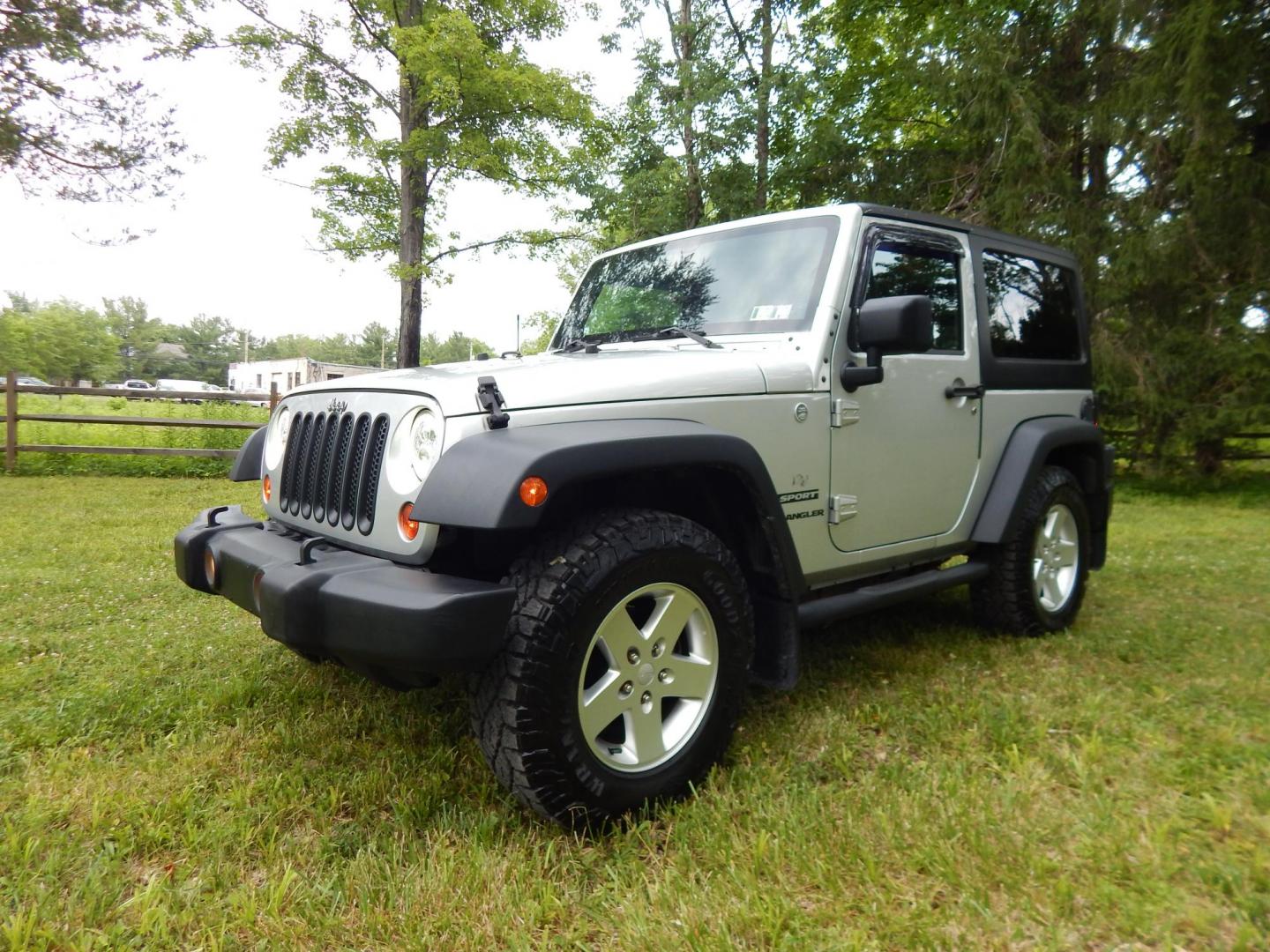 2011 Silver /Black Jeep Wrangler Sport 4WD (1J4AA2D12BL) with an 3.8L V6 OHV 12V engine, Automatic transmission, located at 6528 Lower York Road, New Hope, PA, 18938, (215) 862-9555, 40.358707, -74.977882 - Here we have a 2011 Jeep Wrangler Sport with a 3.8L V6 putting power to an automatic 4x4 transmission. Options include: black cloth, heat and AC, JVC aftermarket radio, cruise control, tilt steering wheel, 3 piece hard top, power windows/locks/mirrors, 17 inch alloy wheels with 4 Goodyear Wrangler t - Photo#0