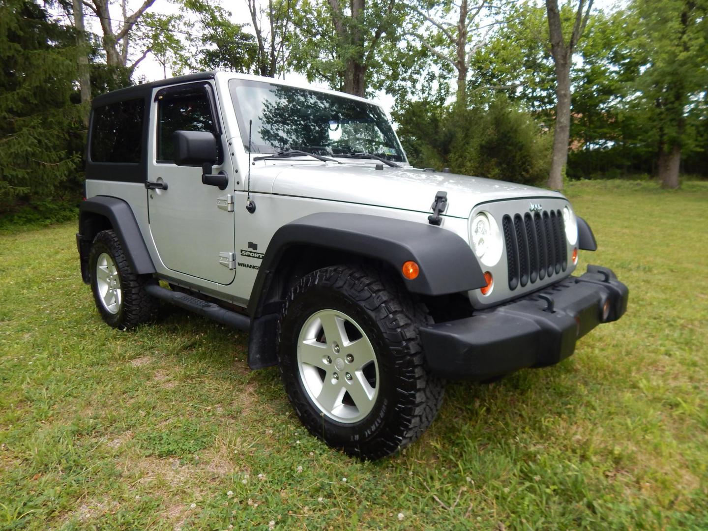 2011 Silver /Black Jeep Wrangler Sport 4WD (1J4AA2D12BL) with an 3.8L V6 OHV 12V engine, Automatic transmission, located at 6528 Lower York Road, New Hope, PA, 18938, (215) 862-9555, 40.358707, -74.977882 - Here we have a 2011 Jeep Wrangler Sport with a 3.8L V6 putting power to an automatic 4x4 transmission. Options include: black cloth, heat and AC, JVC aftermarket radio, cruise control, tilt steering wheel, 3 piece hard top, power windows/locks/mirrors, 17 inch alloy wheels with 4 Goodyear Wrangler t - Photo#6
